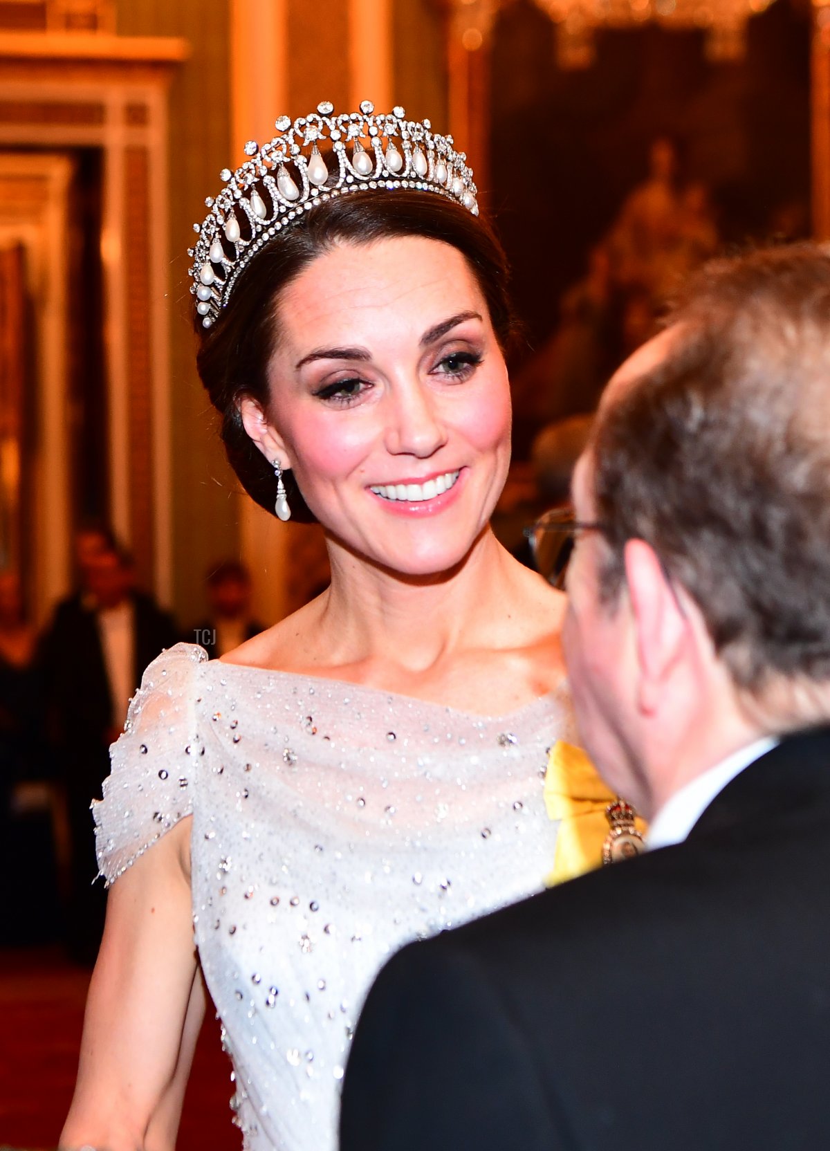 Catherine, Duchess of Cambridge greets guests at an evening reception for members of the Diplomatic Corps at Buckingham Palace on December 04, 2018 in London, England