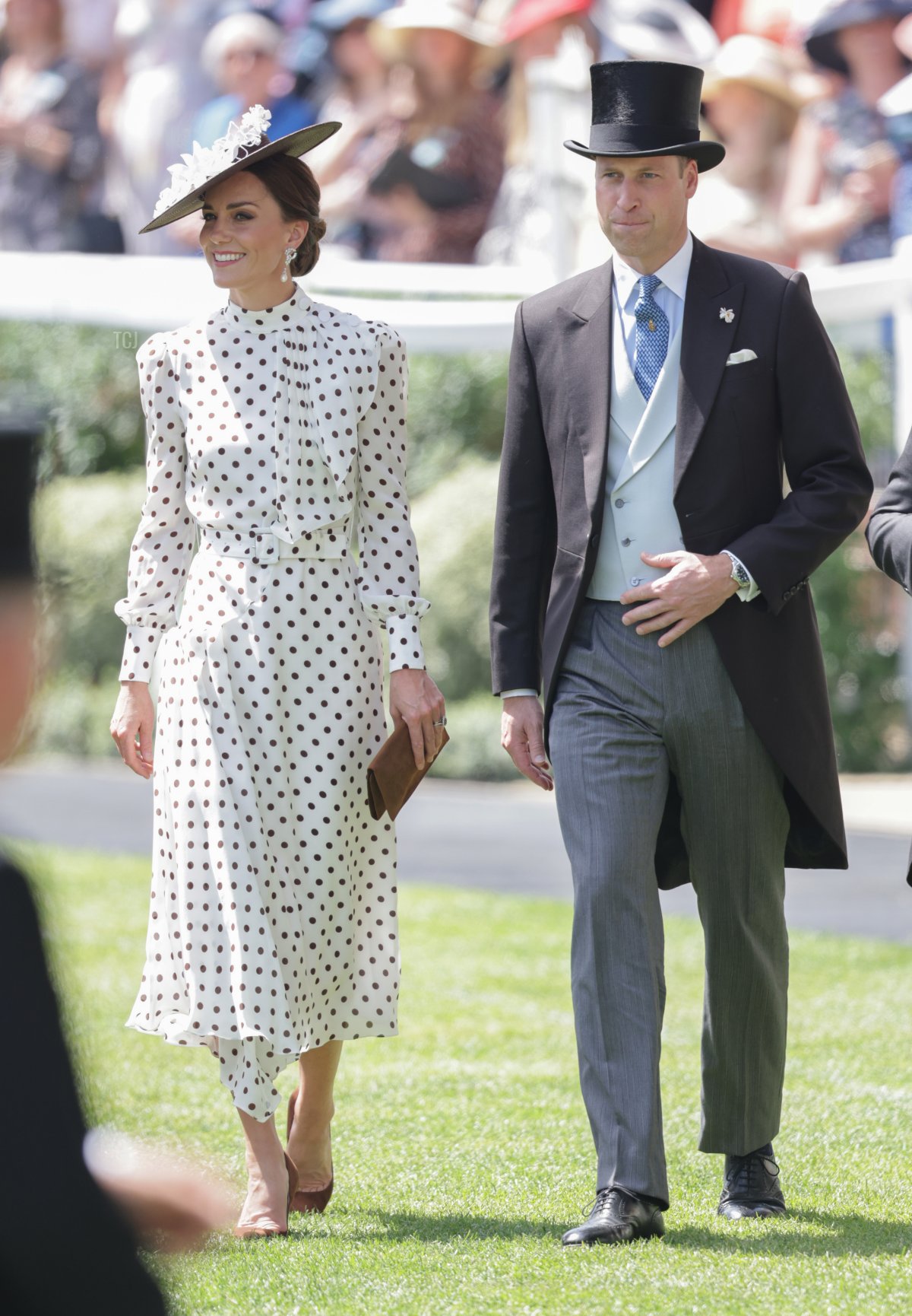 Catherine, Duchess of Cambridge and Prince William, Duke of Cambridge smile as they arrive into the parade ring during Royal Ascot 2022 at Ascot Racecourse on June 17, 2022 in Ascot, England