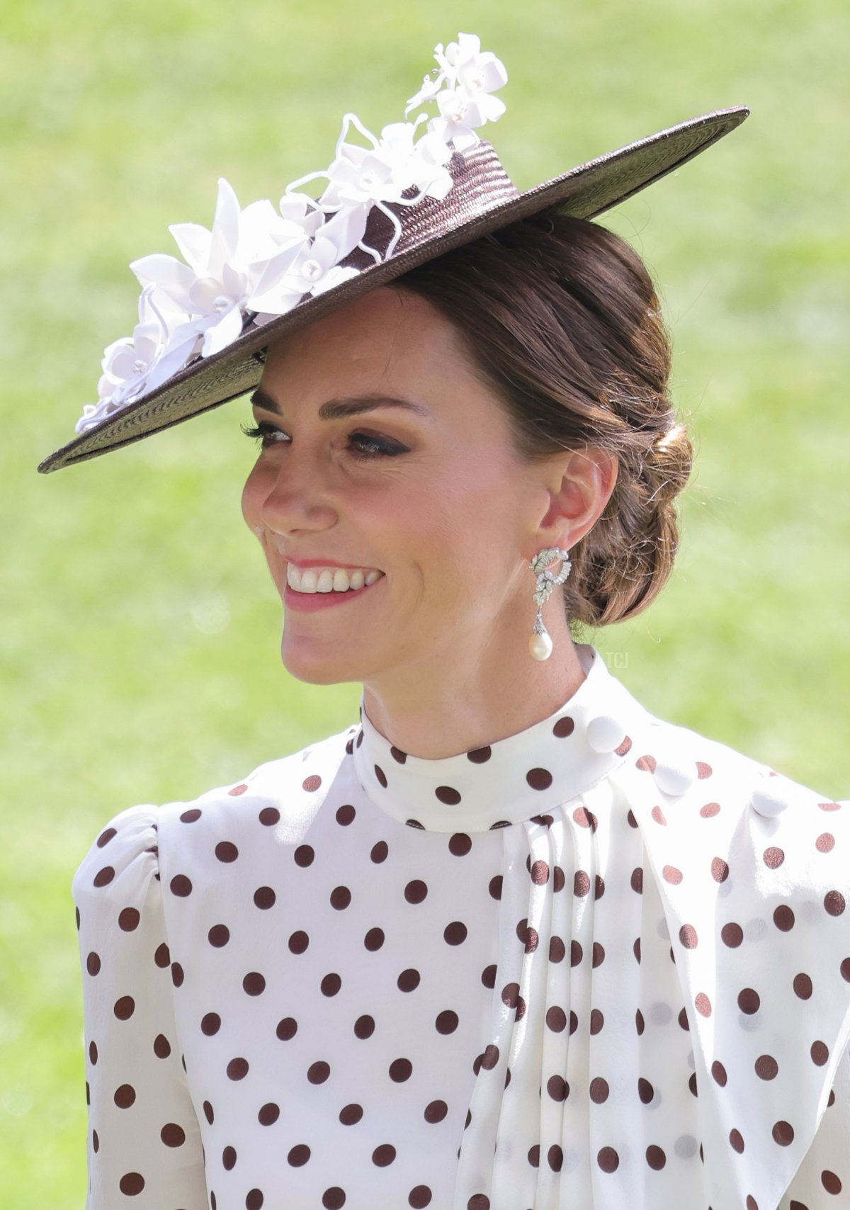 Catherine, Duchess of Cambridge smiles in the parade ring during Royal Ascot 2022 at Ascot Racecourse on June 17, 2022 in Ascot, England