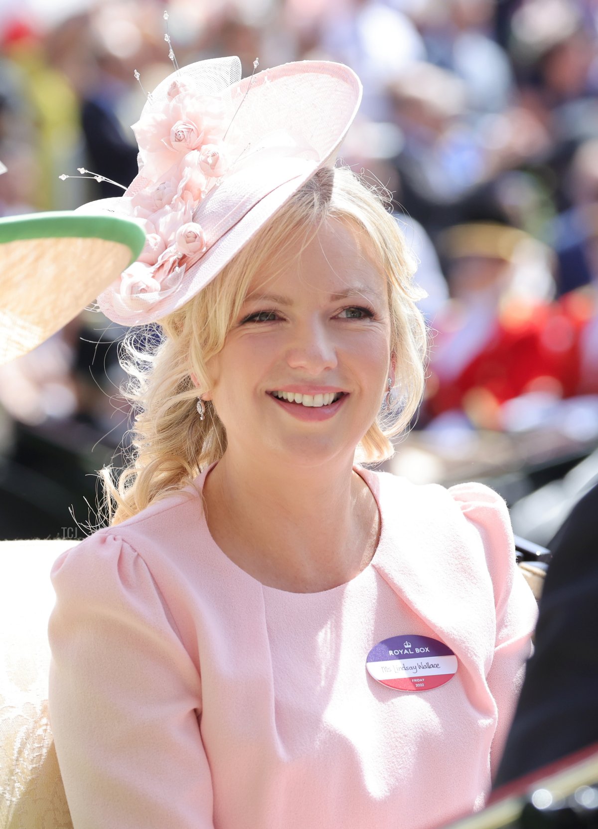 Lindsay Wallace smiles as she arrives into the parade ring on the royal carriage during Royal Ascot 2022 at Ascot Racecourse on June 17, 2022 in Ascot, England