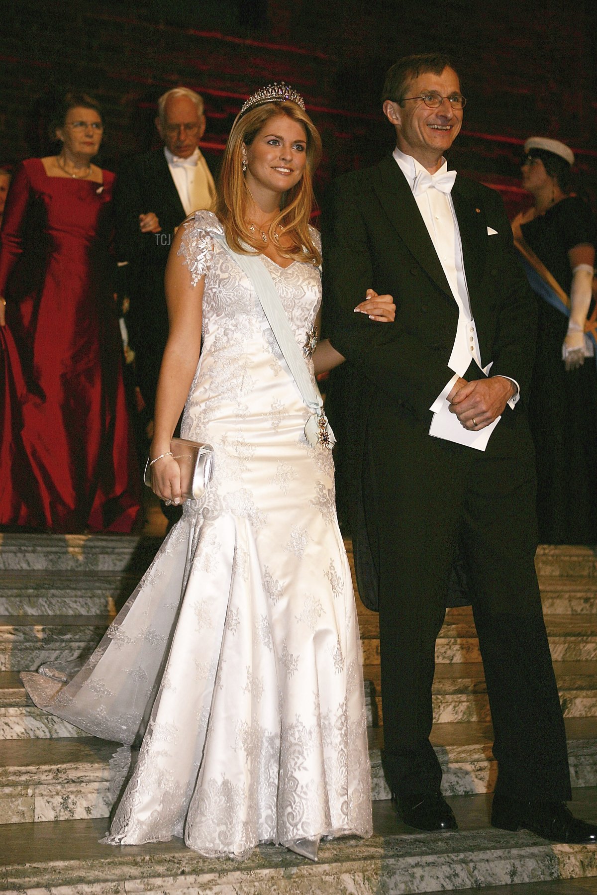 Princess Madeleine of Sweden and Chemistry Nobel Prize Richard R. Schrock arrive at the Nobel Banquet held at the City Hall on December 10, 2005 in Stockholm, Sweden