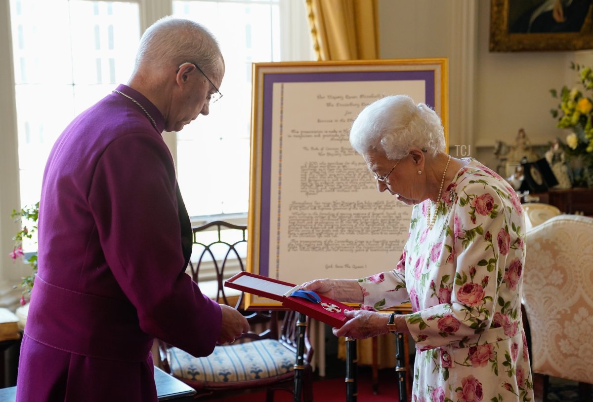 Queen Elizabeth II receives the Archbishop of Canterbury Justin Welby at Windsor Castle, where he presented her with a special 'Canterbury Cross' for her 'unstinting' service to the Church of England over seventy years and a citation for the Cross, which was presented as a framed piece of calligraphy on June 21, 2022 in Windsor, England