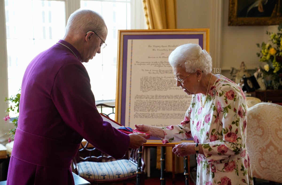 Queen Elizabeth II receives the Archbishop of Canterbury Justin Welby at Windsor Castle, where he presented her with a special 'Canterbury Cross' for her 'unstinting' service to the Church of England over seventy years and a citation for the Cross, which was presented as a framed piece of calligraphy on June 21, 2022 in Windsor, England