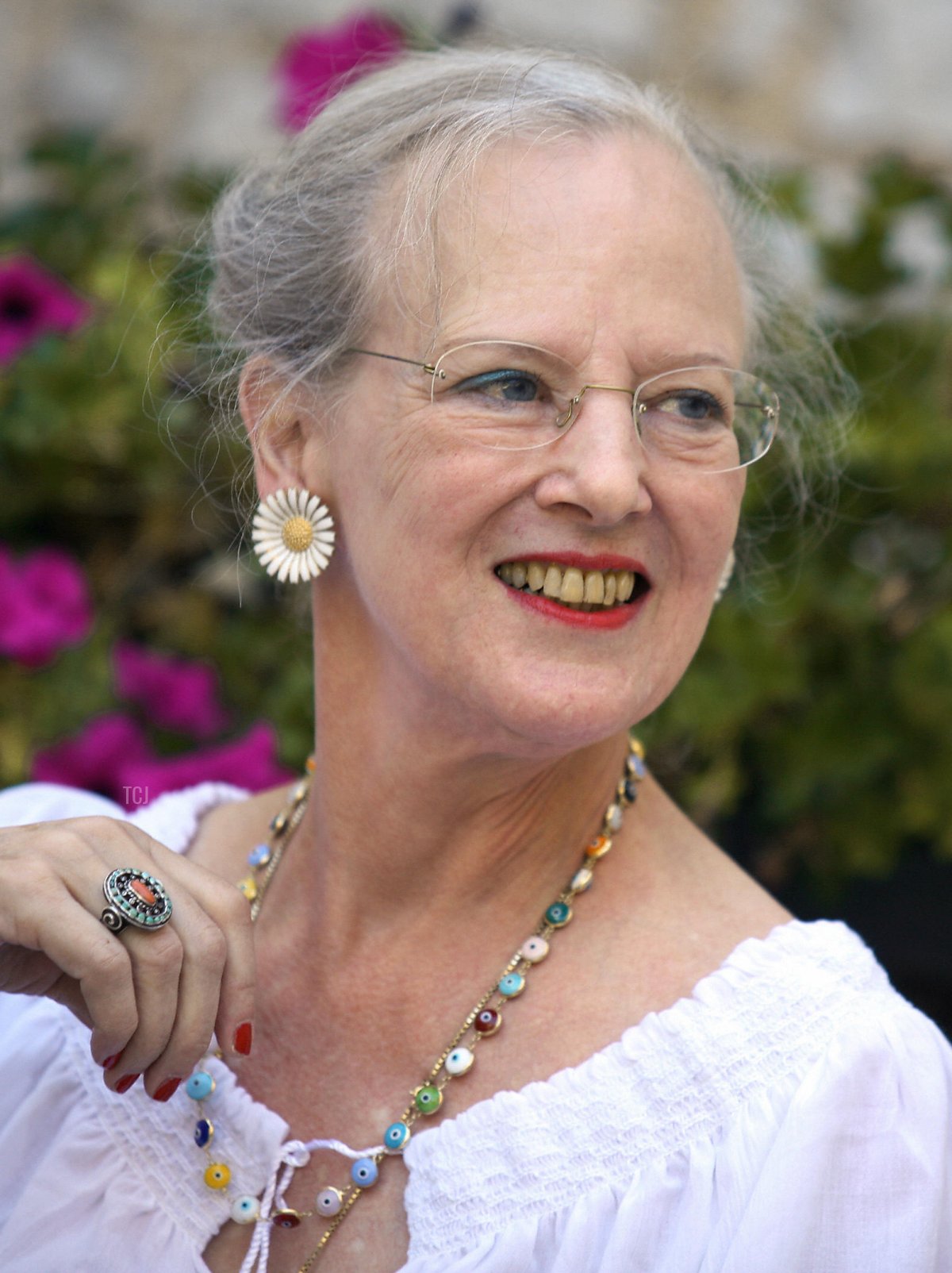 Denmark's Queen Margrethe poses for photographers as she spends time with her husband Prince consort Henrik on holiday in their castle in Caix South West of France, 09 August 2006