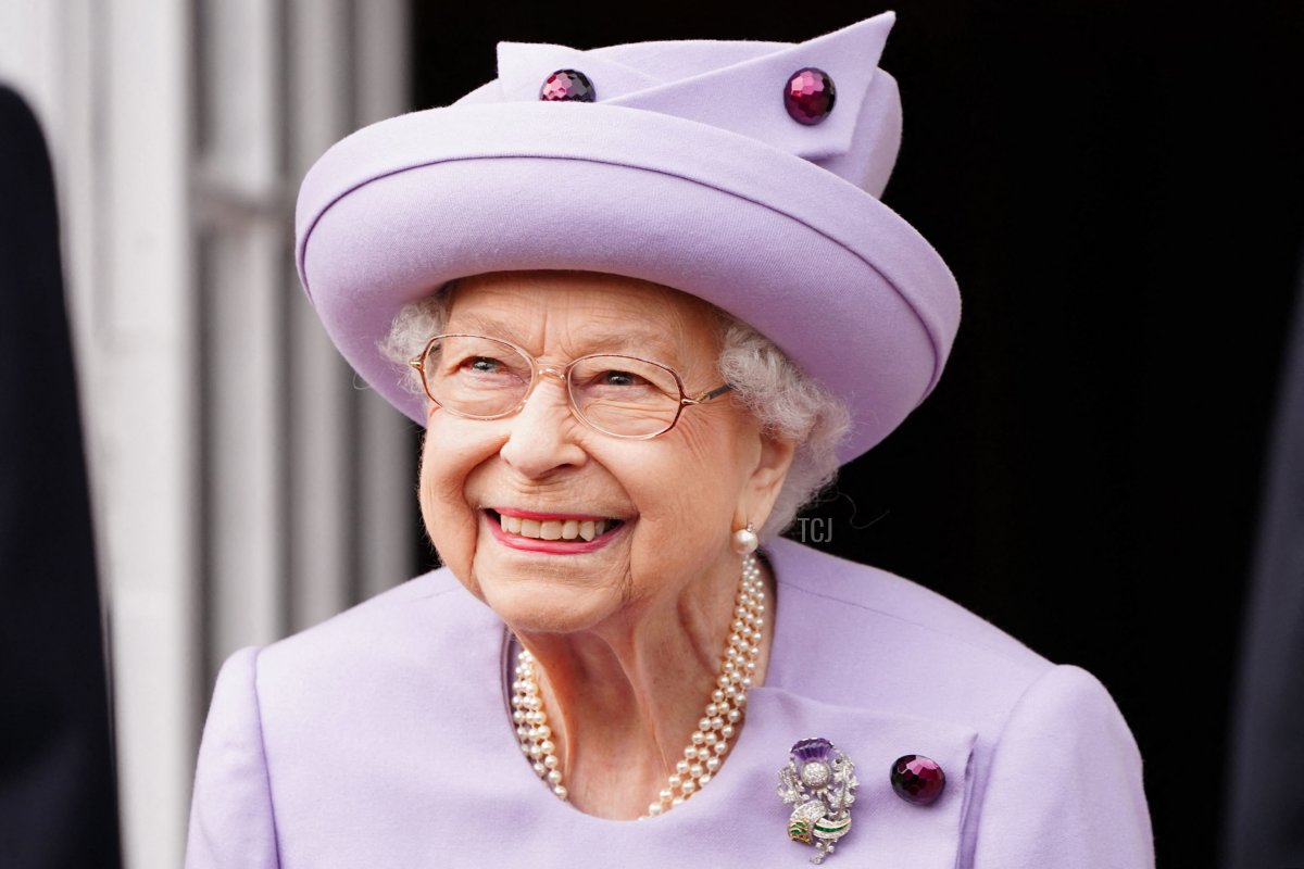 Britain's Queen Elizabeth II smiles as she attends an Armed Forces Act of Loyalty Parade at the Palace of Holyroodhouse in Edinburgh, Scotland, on June 28, 2022