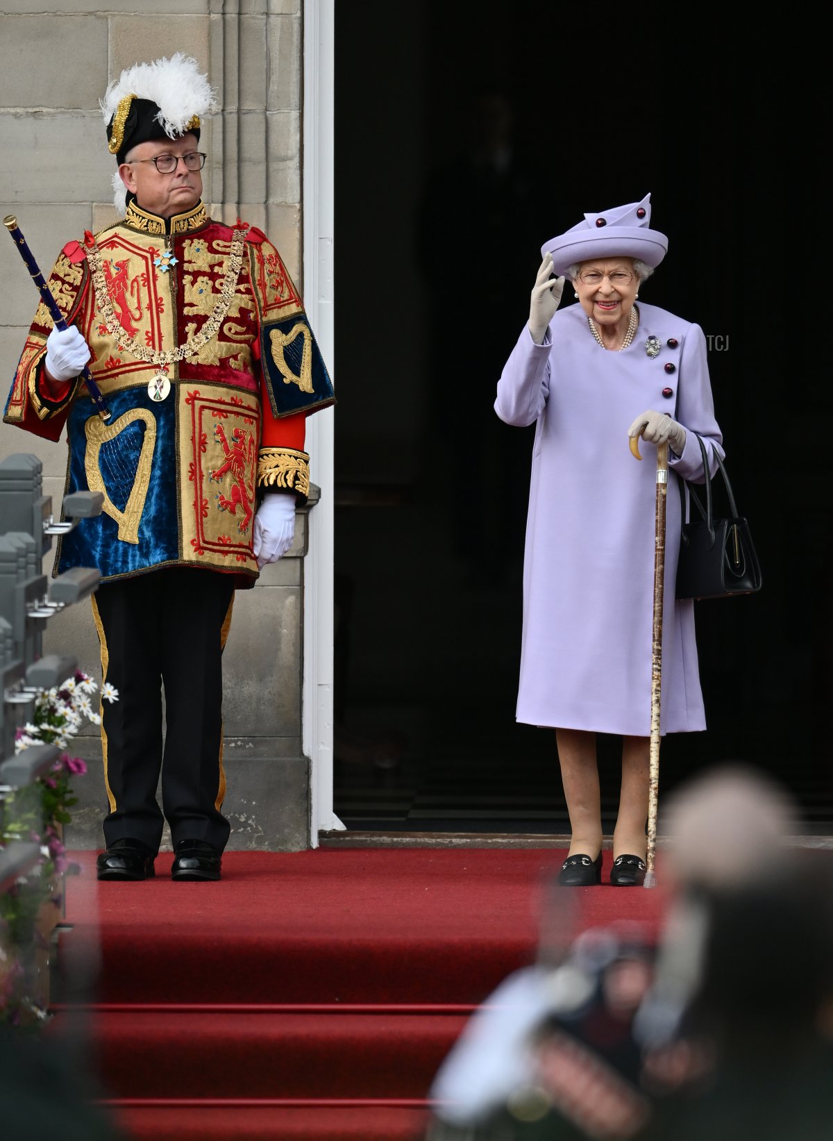 Queen Elizabeth II (C) attends an Armed Forces Act of Loyalty Parade at the Palace of Holyroodhouse on June 28, 2022 in Edinburgh, United Kingdom