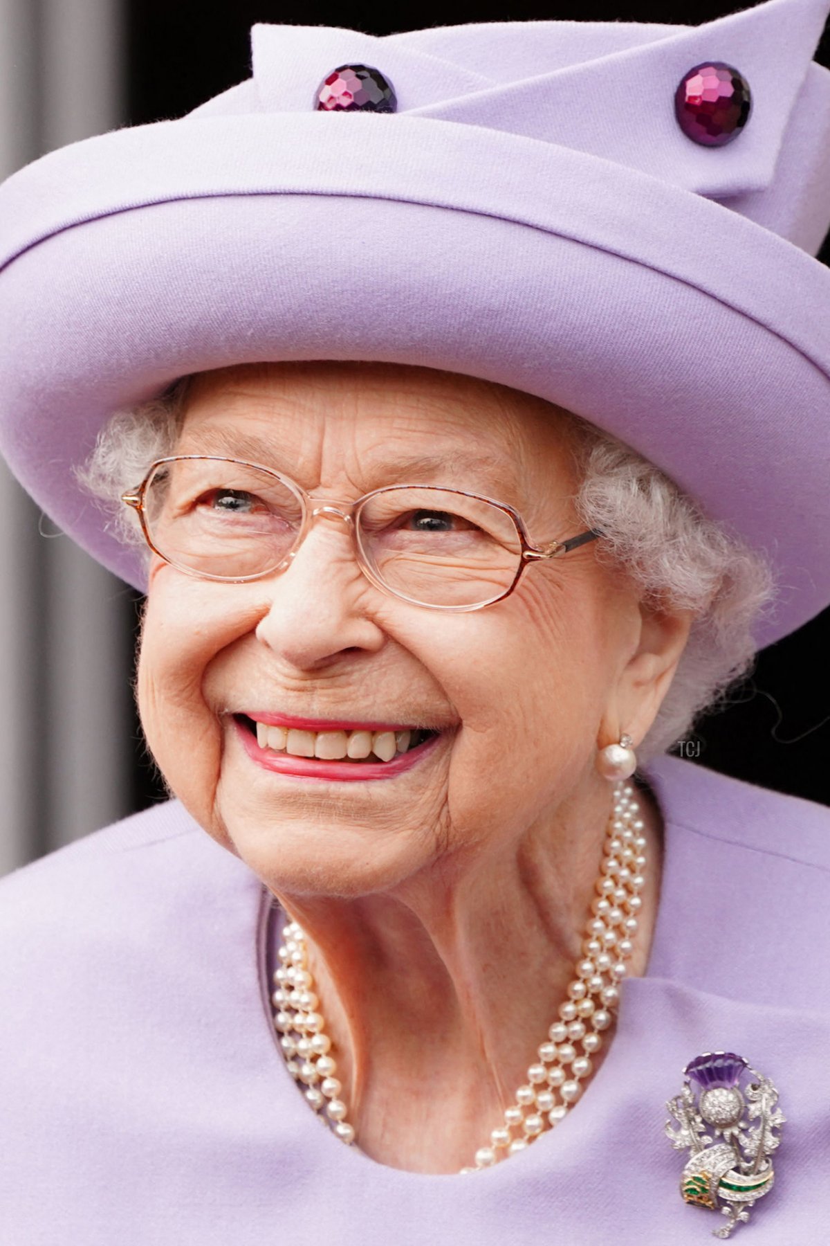 Britain's Queen Elizabeth II smiles as she attends an Armed Forces Act of Loyalty Parade at the Palace of Holyroodhouse in Edinburgh, Scotland, on June 28, 2022
