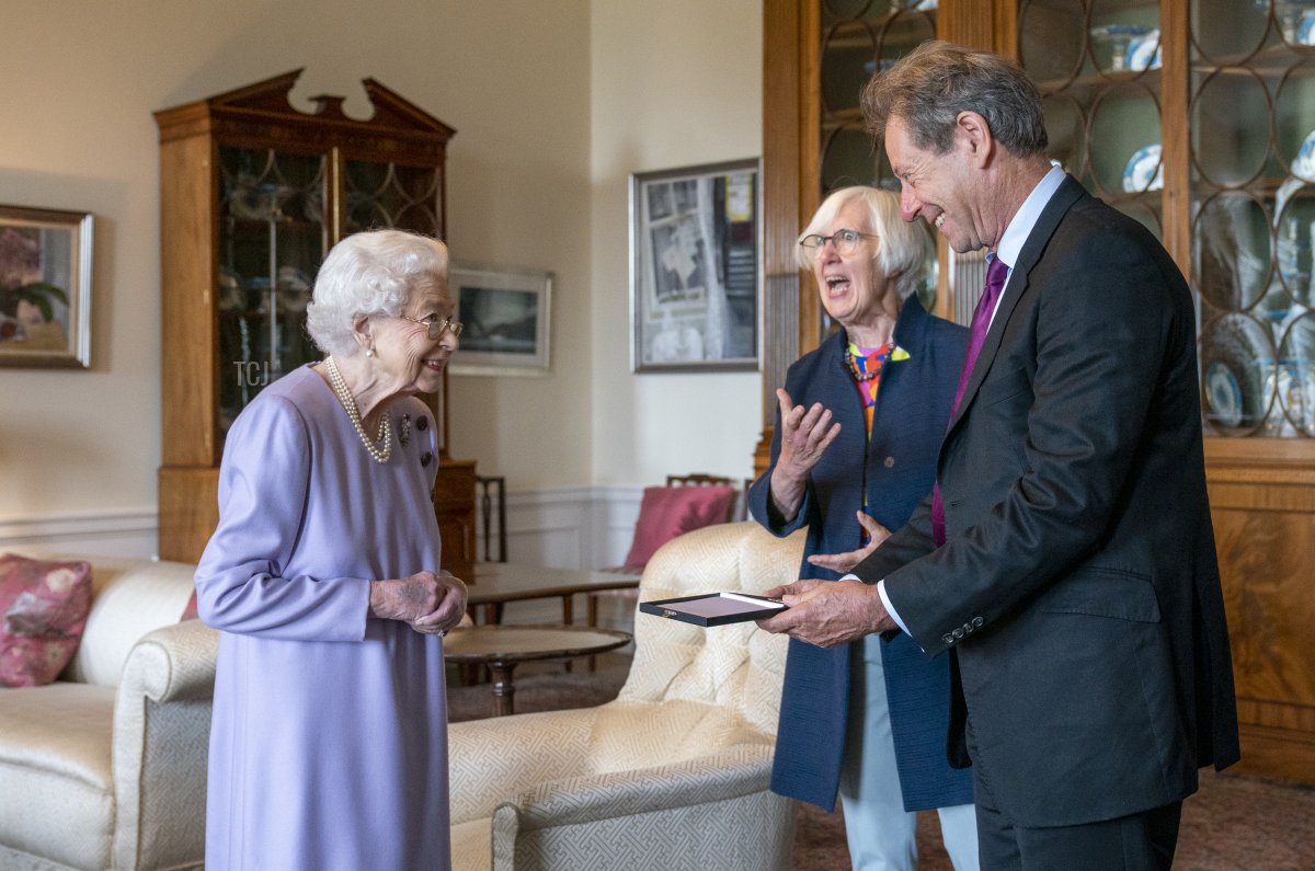 Queen Elizabeth II presents Her Majesty's Medal for Music for the year 2021 to John Wallace CBE at the Palace of Holyroodhouse, Edinburgh on June 28, 2022