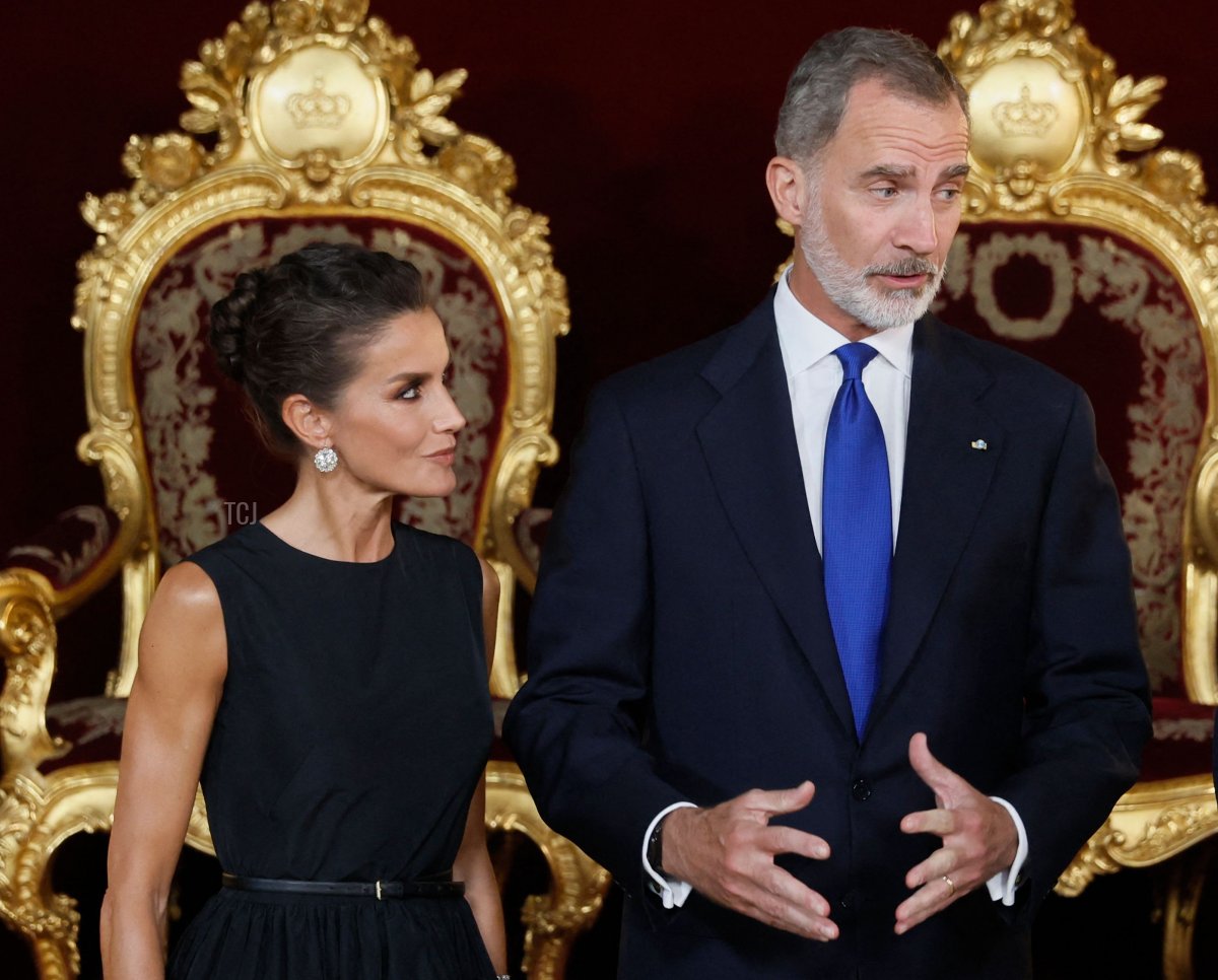 Spain's Queen Letizia, Spain's King Felipe VI and Britain's Prime Minister Boris Johnson pose for pictures before their meeting during the NATO summit, at the Palacio Real in Madrid, on June 28, 2022