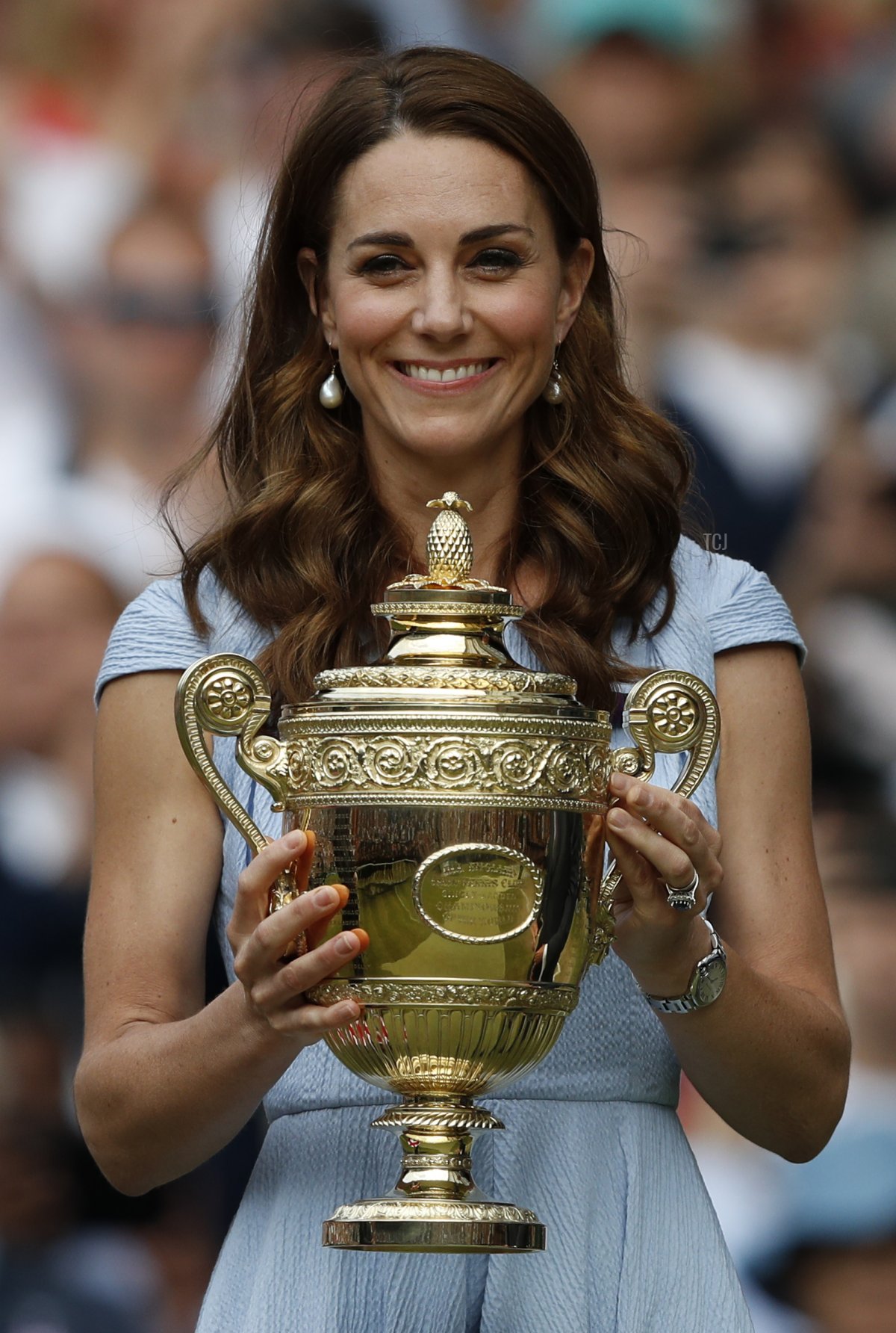 Britain's Catherine, Duchess of Cambridge holds the winner's trophy after the men's singles final on day thirteen of the 2019 Wimbledon Championships at The All England Lawn Tennis Club in Wimbledon, southwest London, on July 14, 2019