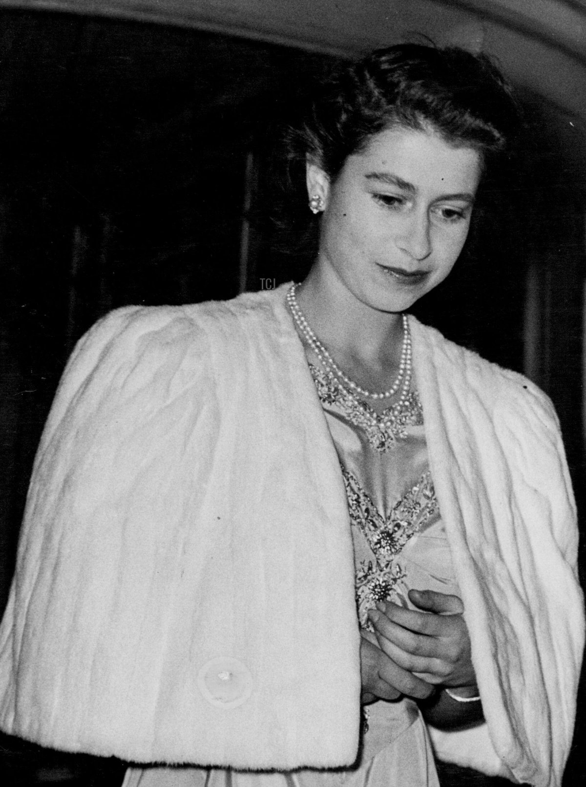 Princess Elizabeth And Lieutenant Philip Mountbatten To Wed; The Princess Attends Private Dinner Party at Dorchester Hotel. Princess Elizabeth - with folded hands - leaving the Dorchester Hotel after the dinner party
