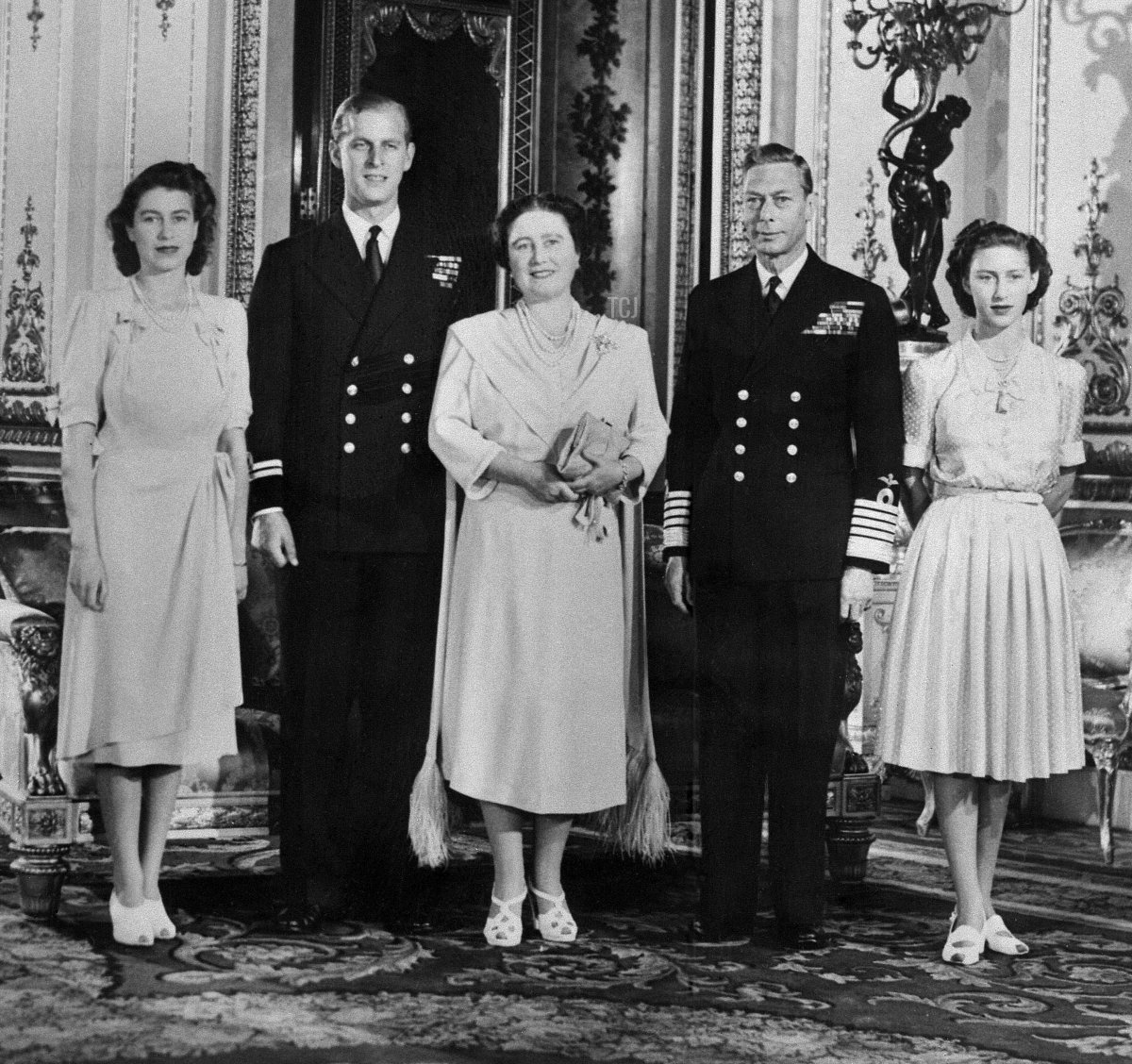 Britain's Princess Elizabeth (future Queen Elizabeth II), Philip Mountbatten (future Duke of Edinburgh), Queen Elizabeth (future Queen Mother), King George VI and Princess Margaret pose in Buckingham Palace on July 9, 1947 in London, the day the engagement of Princess Elizabeth and Philip Mountbatten was officially announced