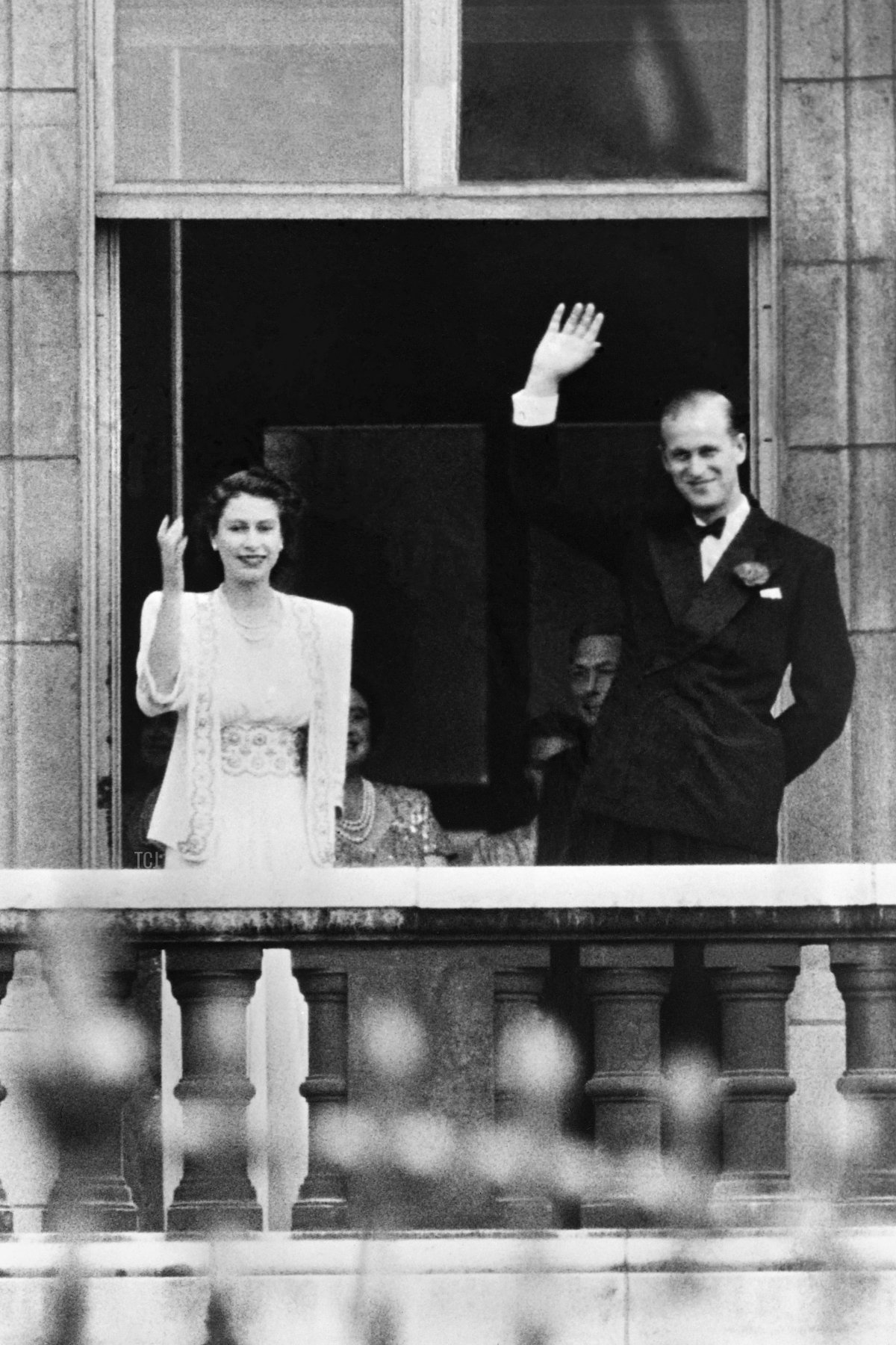 Princess Elizabeth II and Prince Philip, Duke of Edinburgh wave to the crowd from the balcony at Buckingham Palace in London in 1947