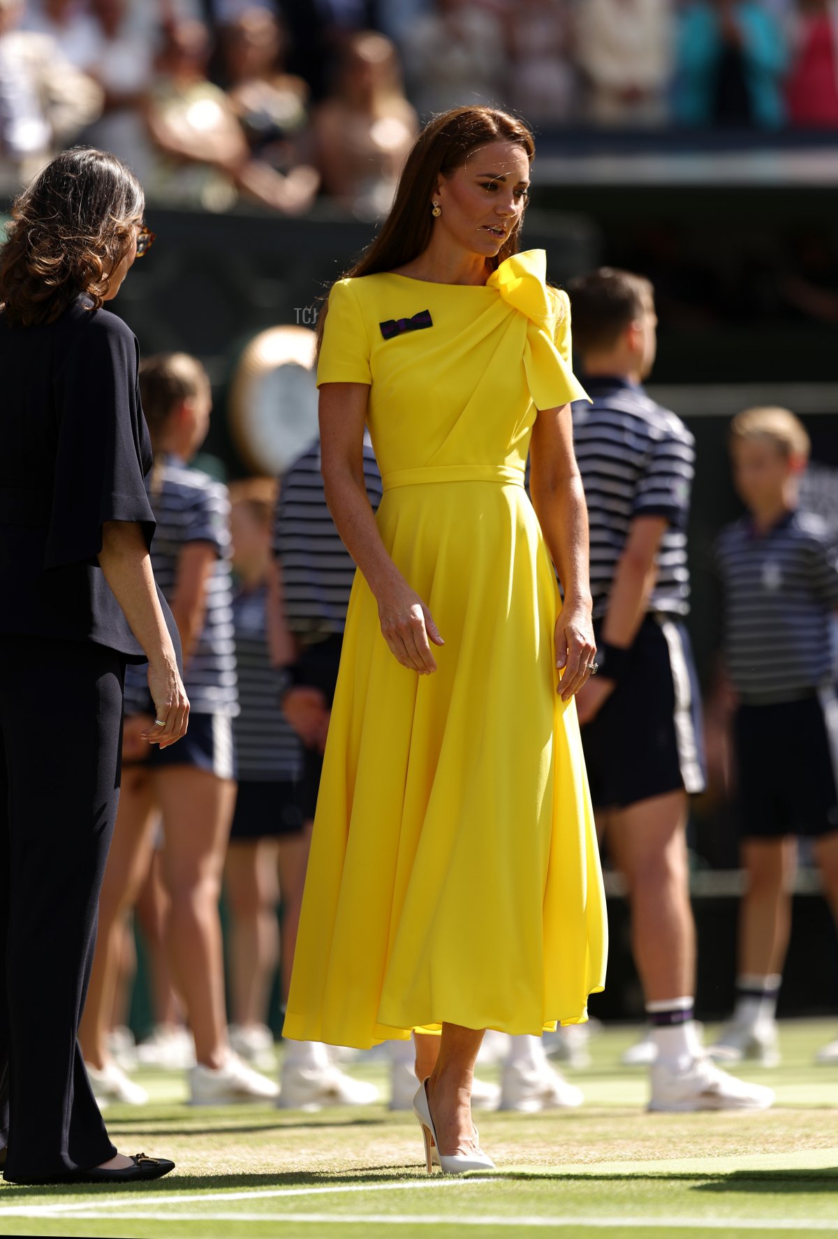 HRH Catherine, The Duchess of Cambridge walks out to present the trophy to Elena Rybakina of Kazakhstan after victory against Ons Jabeur of Tunisia during the Ladies' Singles Final match on day thirteen of The Championships Wimbledon 2022 at All England Lawn Tennis and Croquet Club on July 09, 2022 in London, England