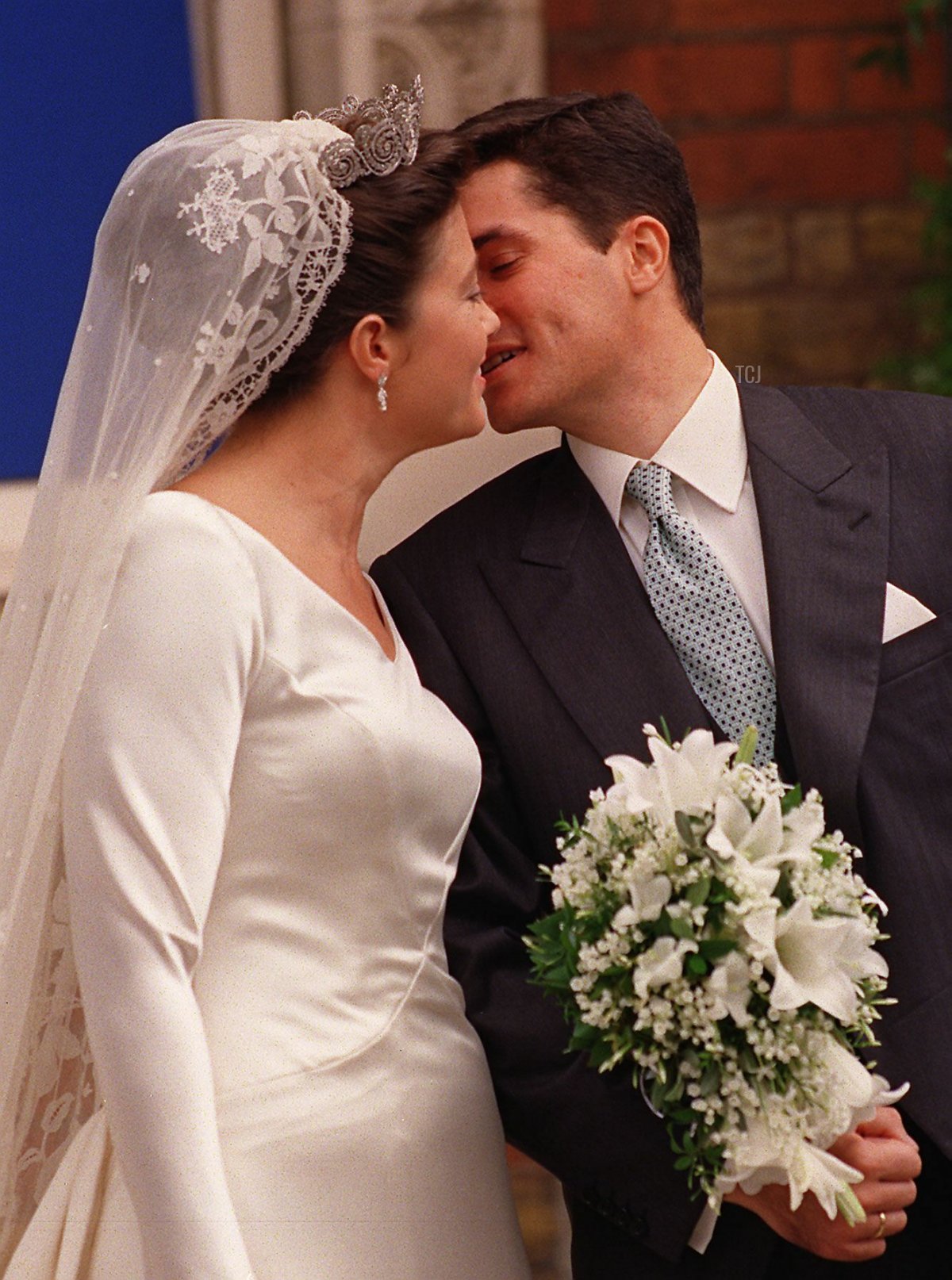 Princess Alexia, daughter of the exiled King Constantine of Greece, kisses her new husband, Carlos Morales Quintana of Spain after their wedding at the Greek Orthodox Cathedral of St. Sophia, Central London, 09 July 1999