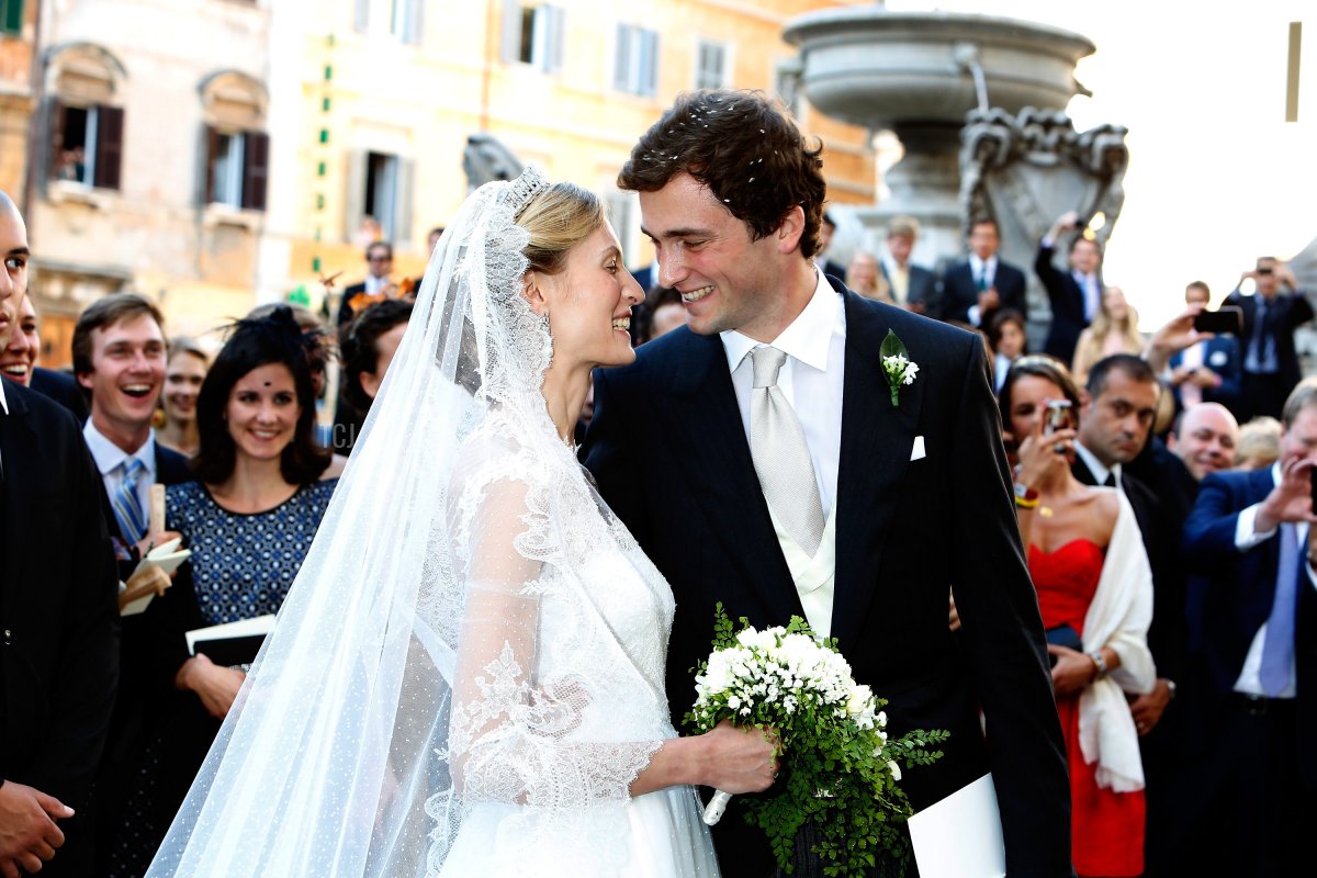 Prince Amedeo of Belgium and Princess Elisabetta Maria Rosboch von Wolkenstein celebrate after their wedding ceremony at Basilica Santa Maria in Trastevere on July 5, 2014 in Rome, Italy