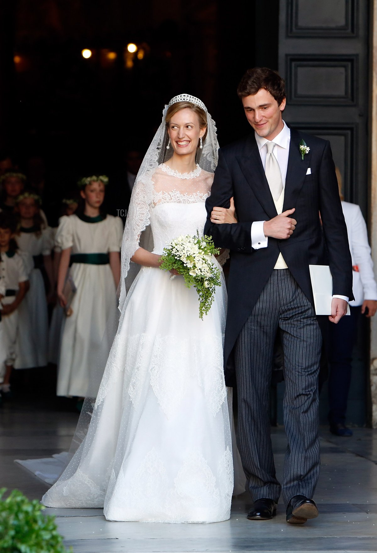 Prince Amedeo of Belgium and Princess Elisabetta Maria Rosboch von Wolkenstein celebrate after their wedding ceremony at Basilica Santa Maria in Trastevere on July 5, 2014 in Rome, Italy