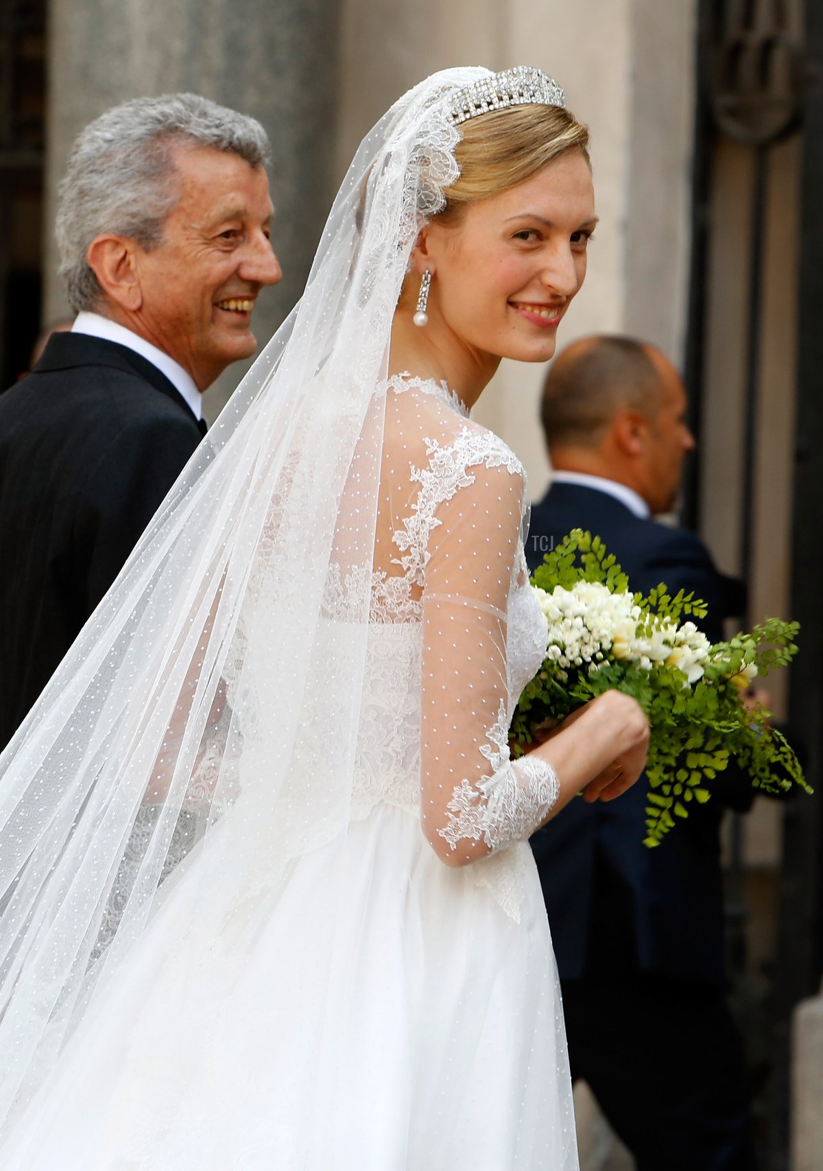 Elisabetta Maria Rosboch von Wolkenstein with her father Ettore Rosboch von Wolkenstein arrives for her wedding to Prince Amedeo of Belgium at Basilica Santa Maria in Trastevere on July 5, 2014 in Rome, Italy