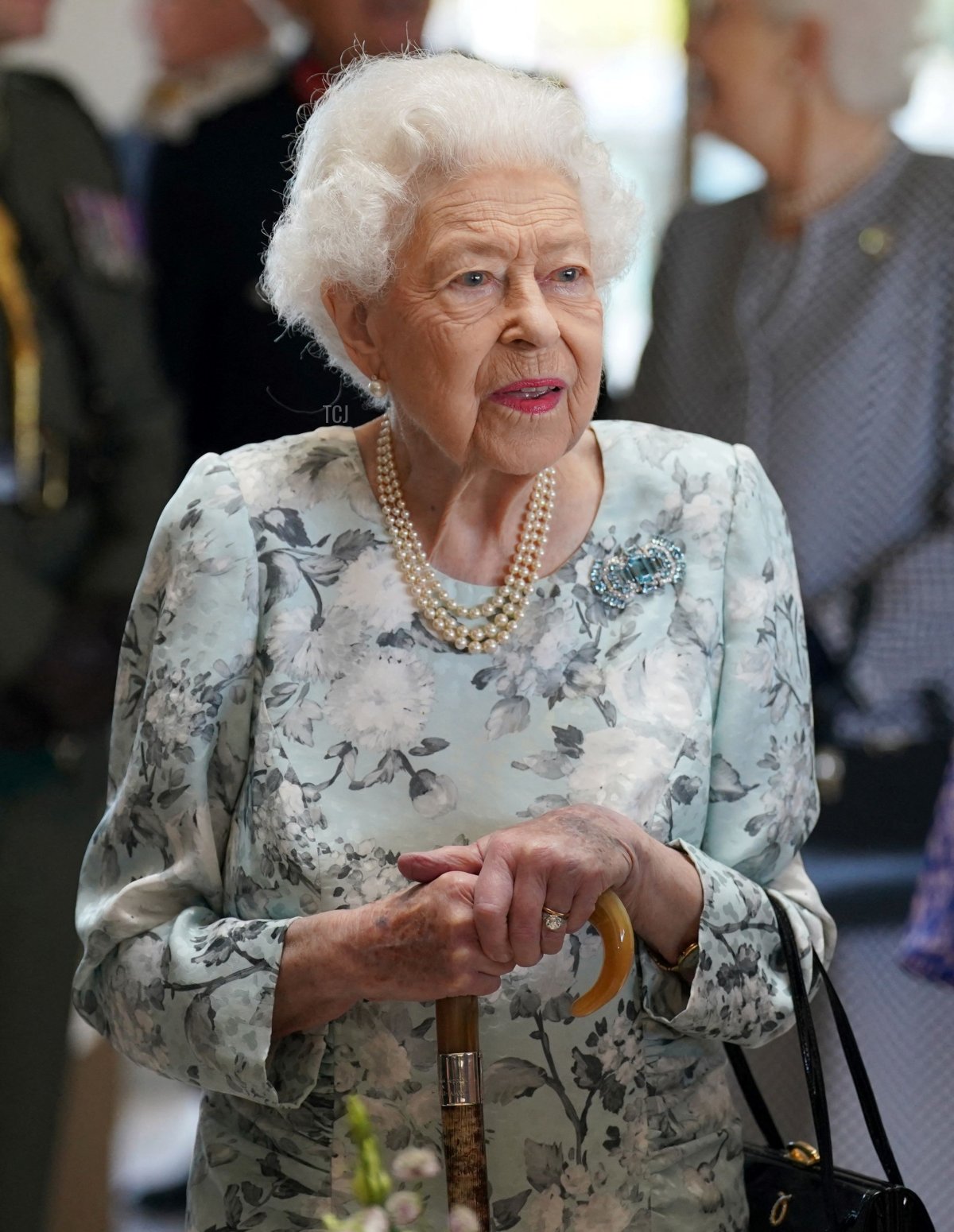 Britain's Queen Elizabeth II speaks to guests during a visit to officially open the new building of Thames Hospice in Maidenhead, Berkshire, on July 15, 2022