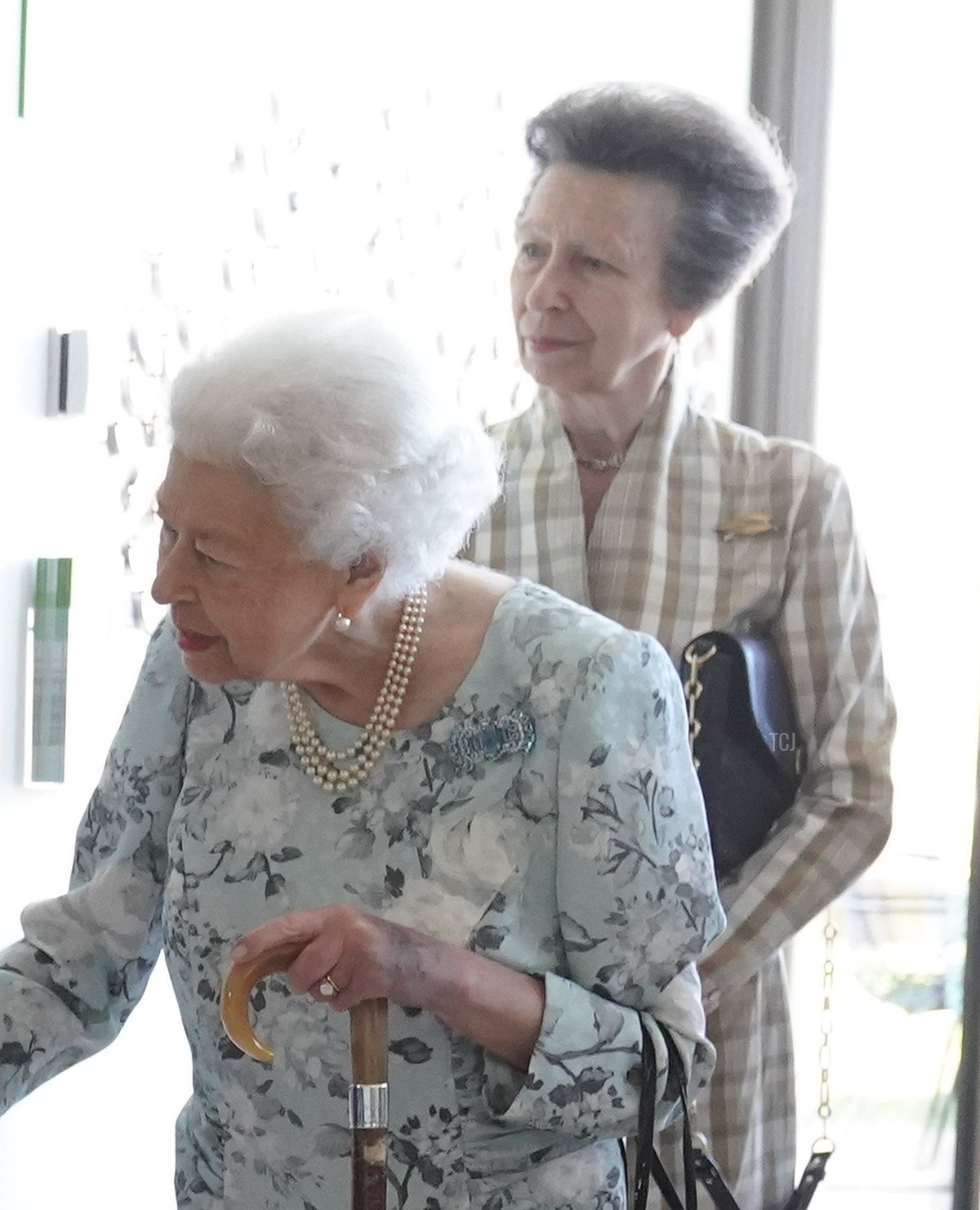 Queen Elizabeth II unveils a plaque as Princess Anne, Princess Royal watches during a visit to officially open the new building at Thames Hospice on July 15, 2022 in Maidenhead, England