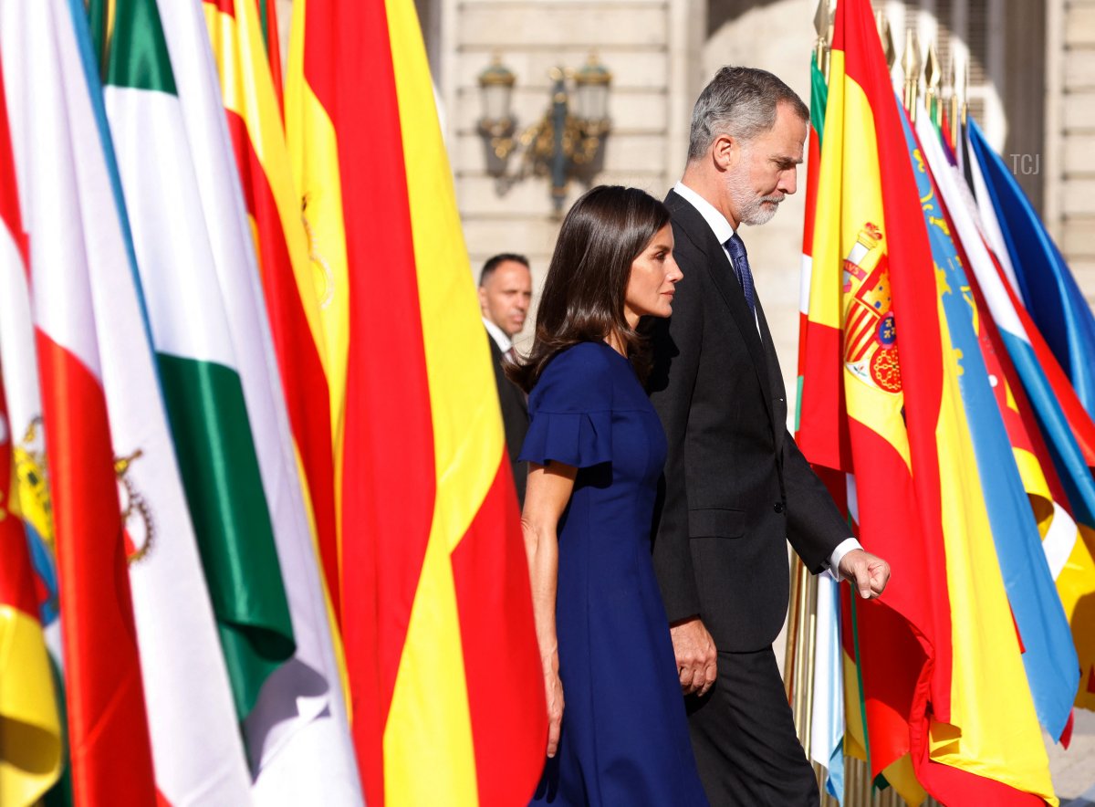 King Felipe VI of Spain (R) and his wife Queen Letizia arrive to attend a state ceremony to honour the victims of the coronavirus crisis as well as those public servants who have been fighting on the front line against the pandemic in Spain at the Royal Palace in Madrid on July 15, 2022