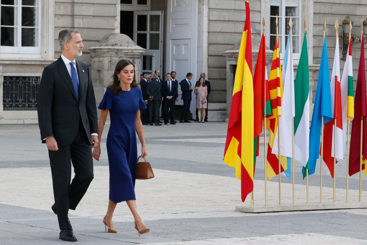 King Felipe VI of Spain (L) and his wife Queen Letizia arrive to attend a state ceremony to honour the victims of the coronavirus crisis as well as those public servants who have been fighting on the front line against the pandemic in Spain at the Royal Palace in Madrid on July 15, 2022