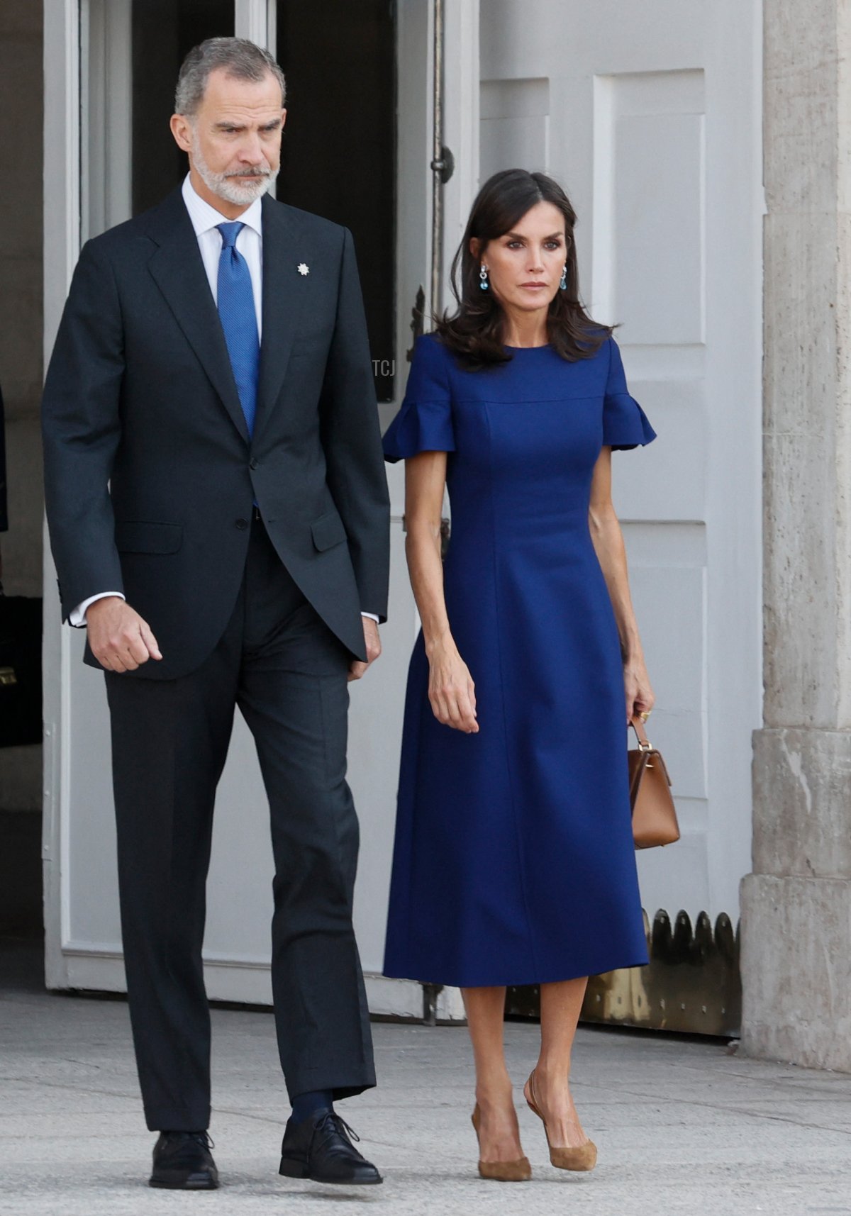 King Felipe VI of Spain (L) and his wife Queen Letizia arrive to attend a state ceremony to honour the victims of the coronavirus crisis as well as those public servants who have been fighting on the front line against the pandemic in Spain, on July 15, 2022, at the Royal Palace in Madrid