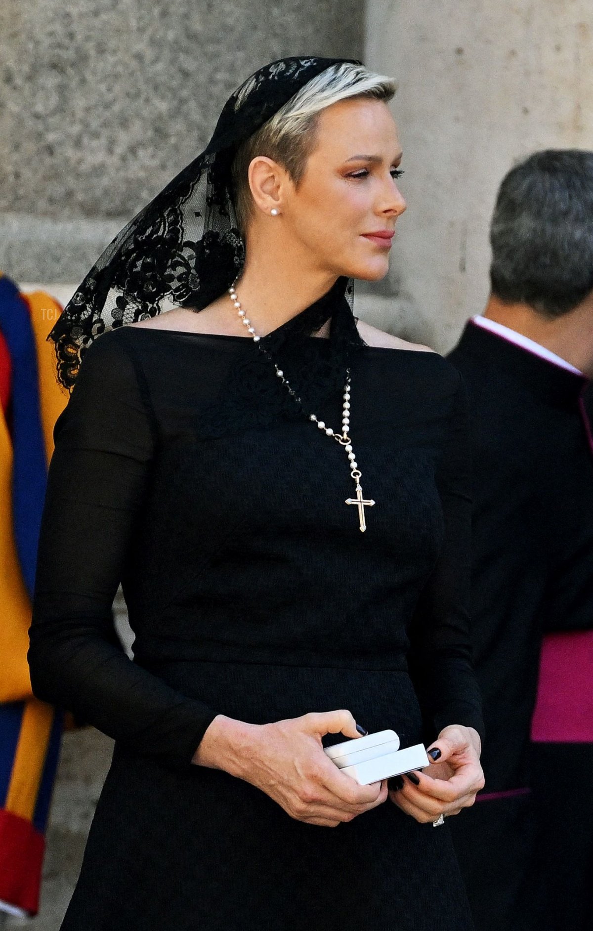 Monaco's Prince Alberto II and Princess Charlene walk along the San Damaso courtyard as they leave following a private audience with Pope Francis, at the Vatican on July 20, 2022