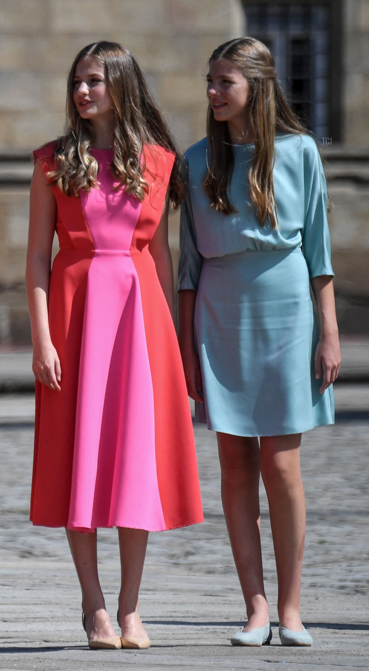 Spanish Crown Princess of Asturias Leonor (L) and Spanish Princess Sofia leave after attending the "National Offering to the Apostle Santiago" at the Cathedral of Santiago de Compostela, on July 25, 2022