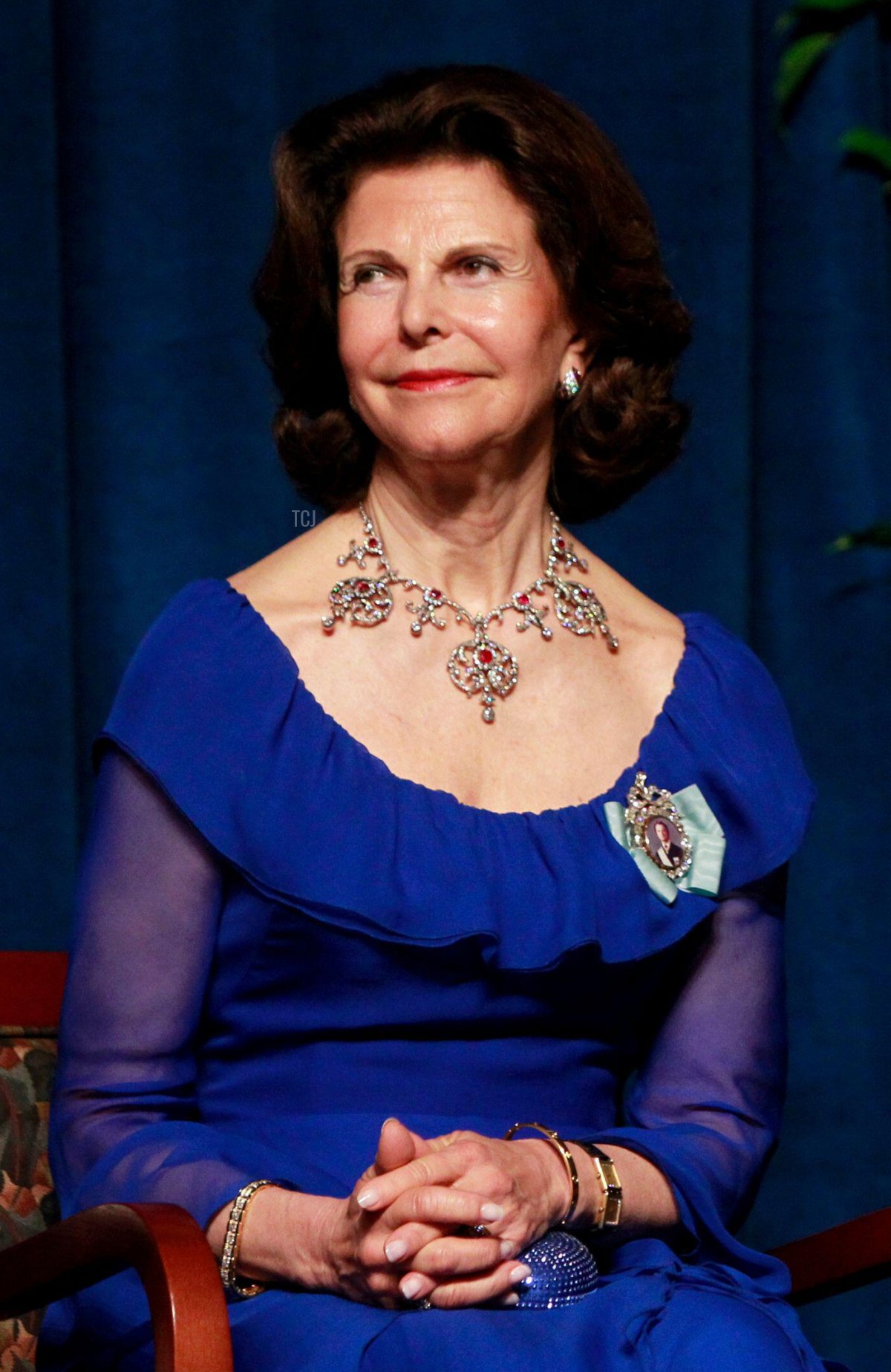 Sweden's King Carl XVI Gustaf (R) and Queen Silvia listen to remarks during a jubilee gala dinner to celebrate the 375th anniversary of the founding of the New Sweden Colony in Wilmington, Delaware May 11, 2013