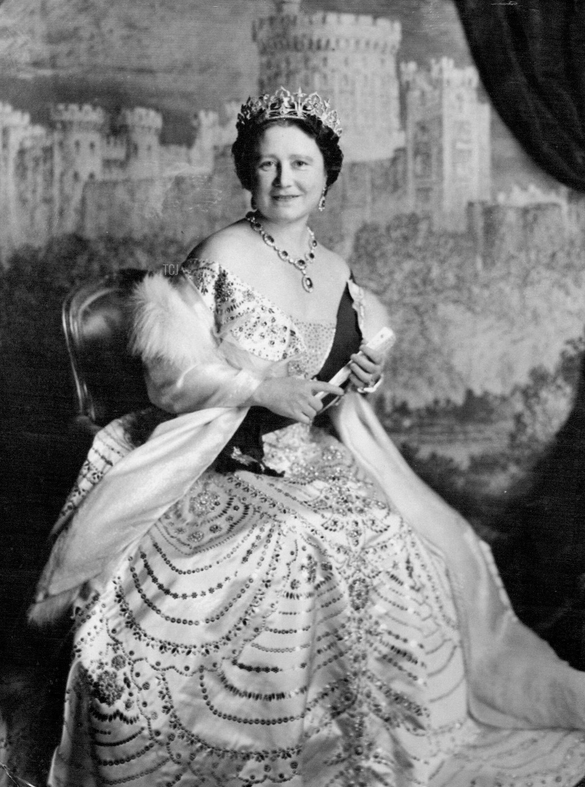 This New Photo of Queen Elizabeth The Queen Mother was made by Cecil Beaton in The music room of Buckingham Palace against a Backcloth showing Windsor Castle