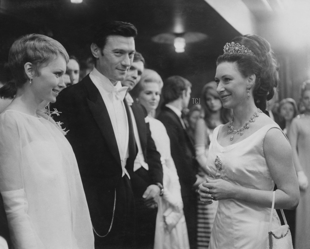 Princess Margaret meets Lithuanian-born actor Laurence Harvey (1928 - 1973) and actress Mia Farrow at the Royal Film Performance of the film 'The Taming of the Shrew' at the Odeon Leicester Square, London, 27th February 1967