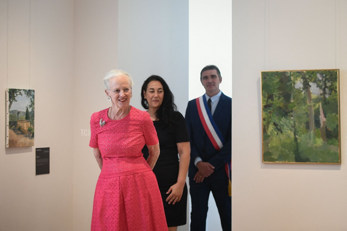 Queen Margrethe II of Denmark (L) inaugurates her works, flanked by Cahor's mayor Jean-Marc Vayssouze-Faure (R) and the museum director Rachel Amalric (C) at the Henri Martin museum in Cahors, southern France, on August 17, 2022