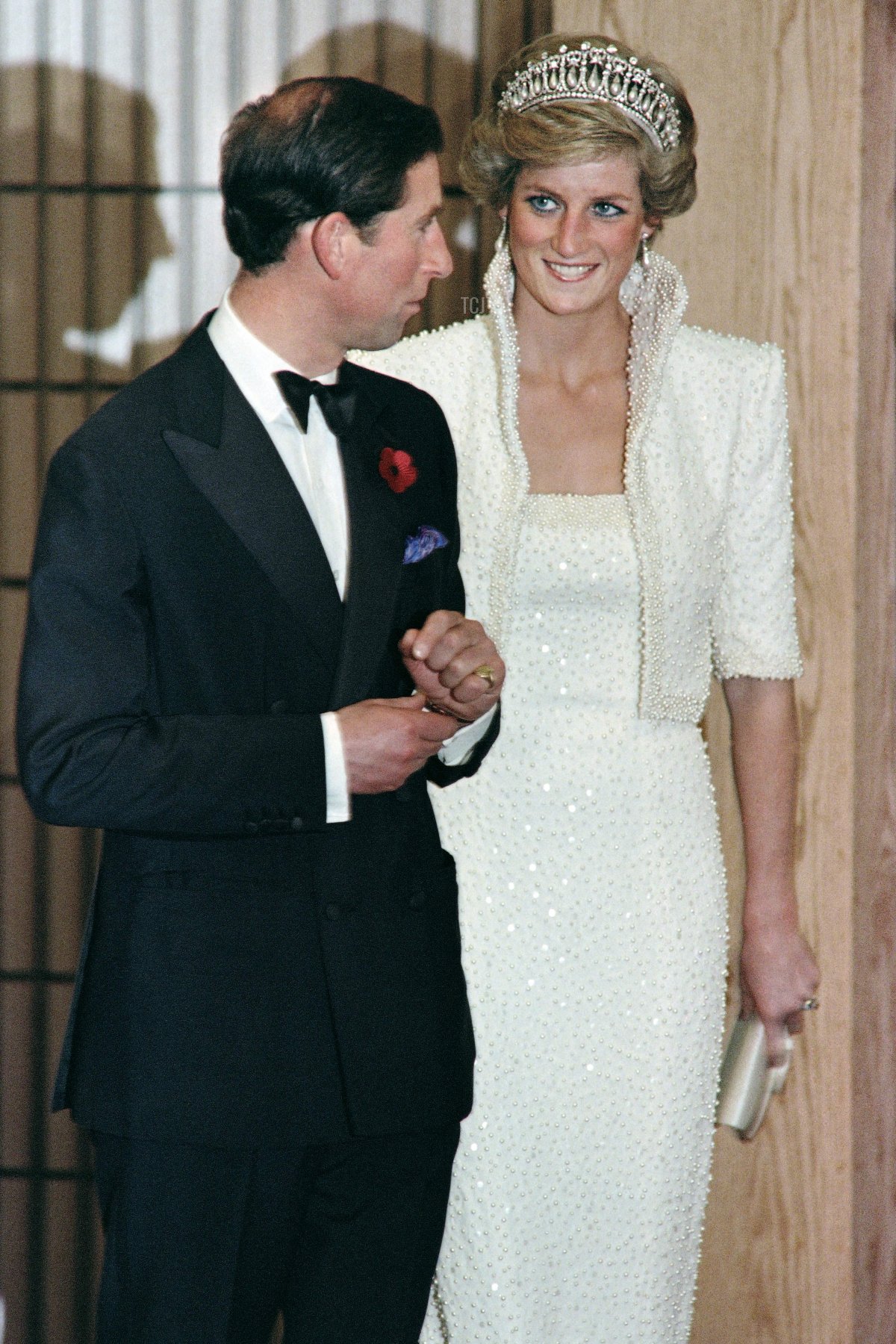 Britain's Prince Charles and Princess Diana walk out from concert hall at the Hong Kong Cultural Center on November 7, 1989