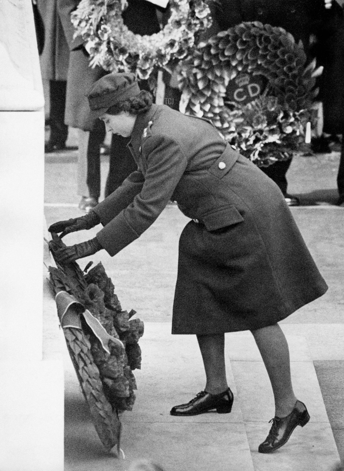 Princess Elizabeth of York, future Queen Elizabeth II, in ATS uniform, lays wreath at the Cenotaph during the first time armistice ceremony since 1938, on November 11, 1945, in London