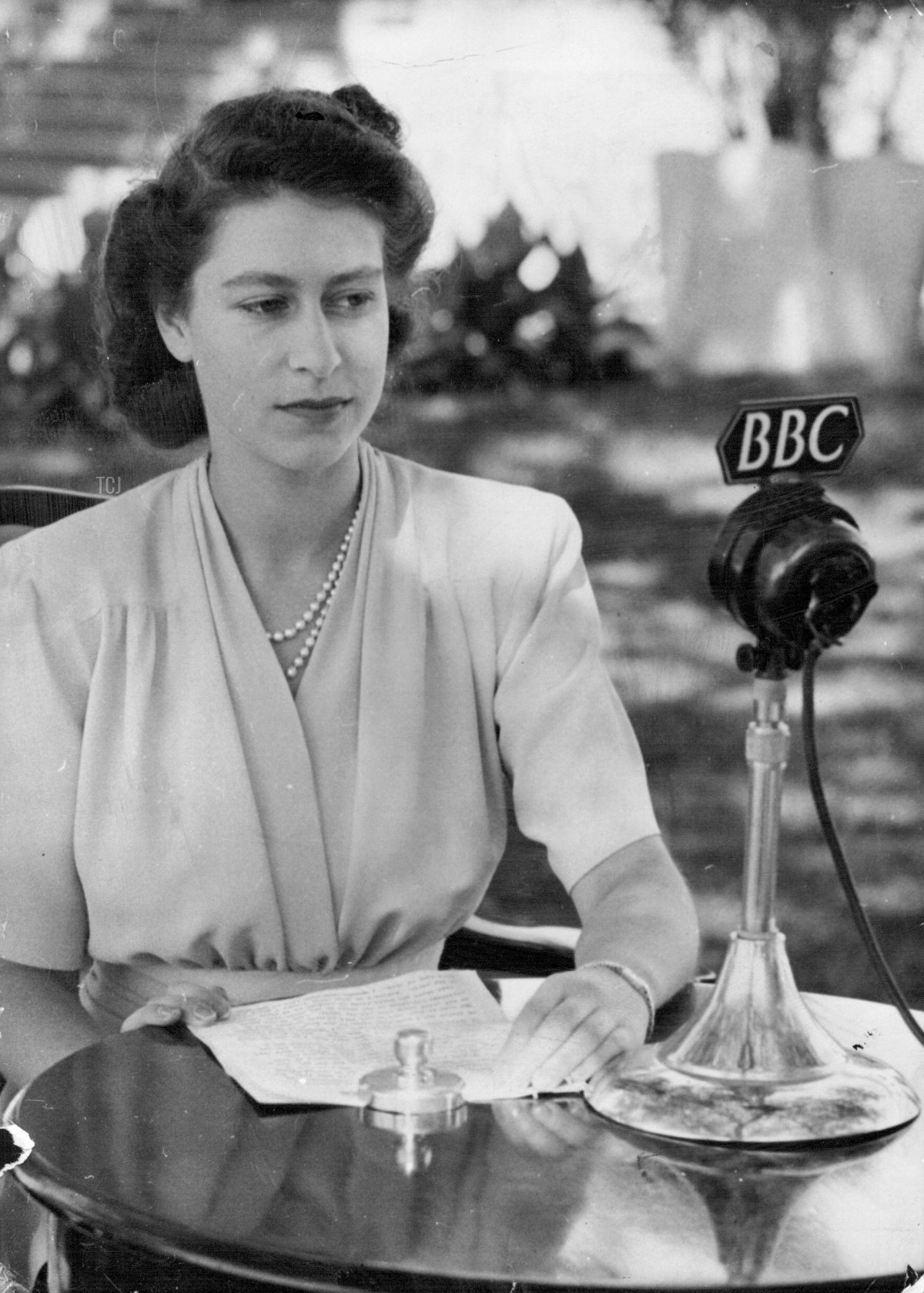 A specially posed portrait of H.R.H. Princess Elizabeth before the Microphone for her Birthday speech April 21 which she made from Cape Town, South Africa. April 29, 1947