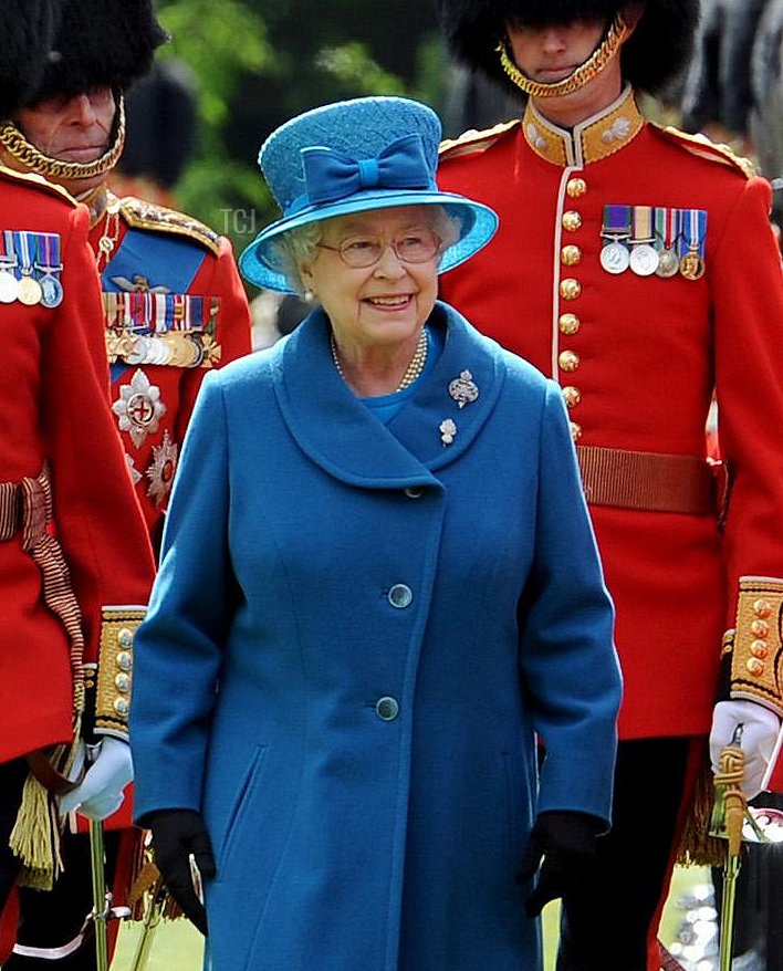 Queen Elizabeth II inspects the Grenadier Guards before presenting their new colours in the garden of Buckingham Palace on May 11, 2010 in London, England