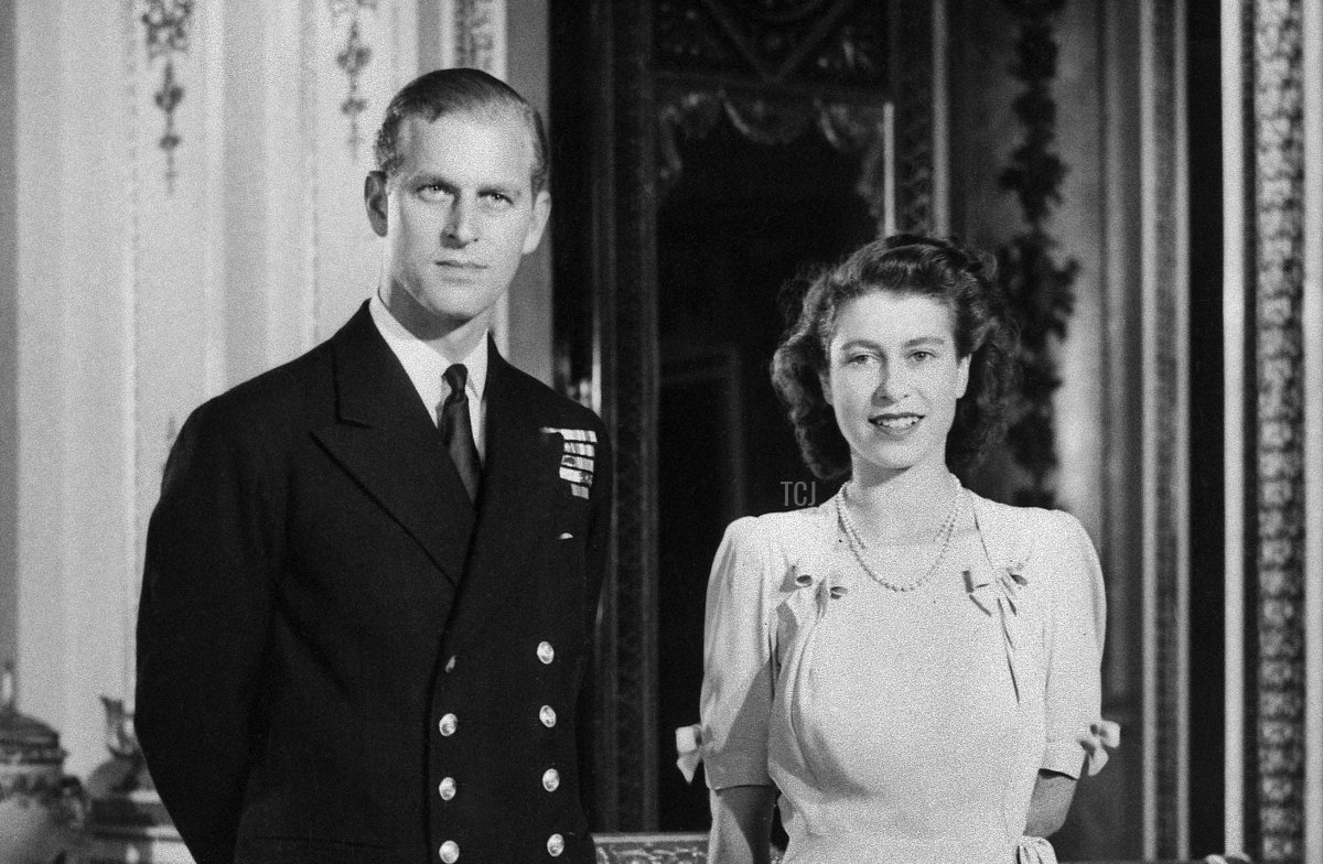 Princess Elizabeth (future Queen Elizabeth II) and her Fiance Philip Mountbatten (the future Duke of Edinburgh) pose in Buckingham Palace in London on July 9, 1947 in London, the day their engagement was officially announced