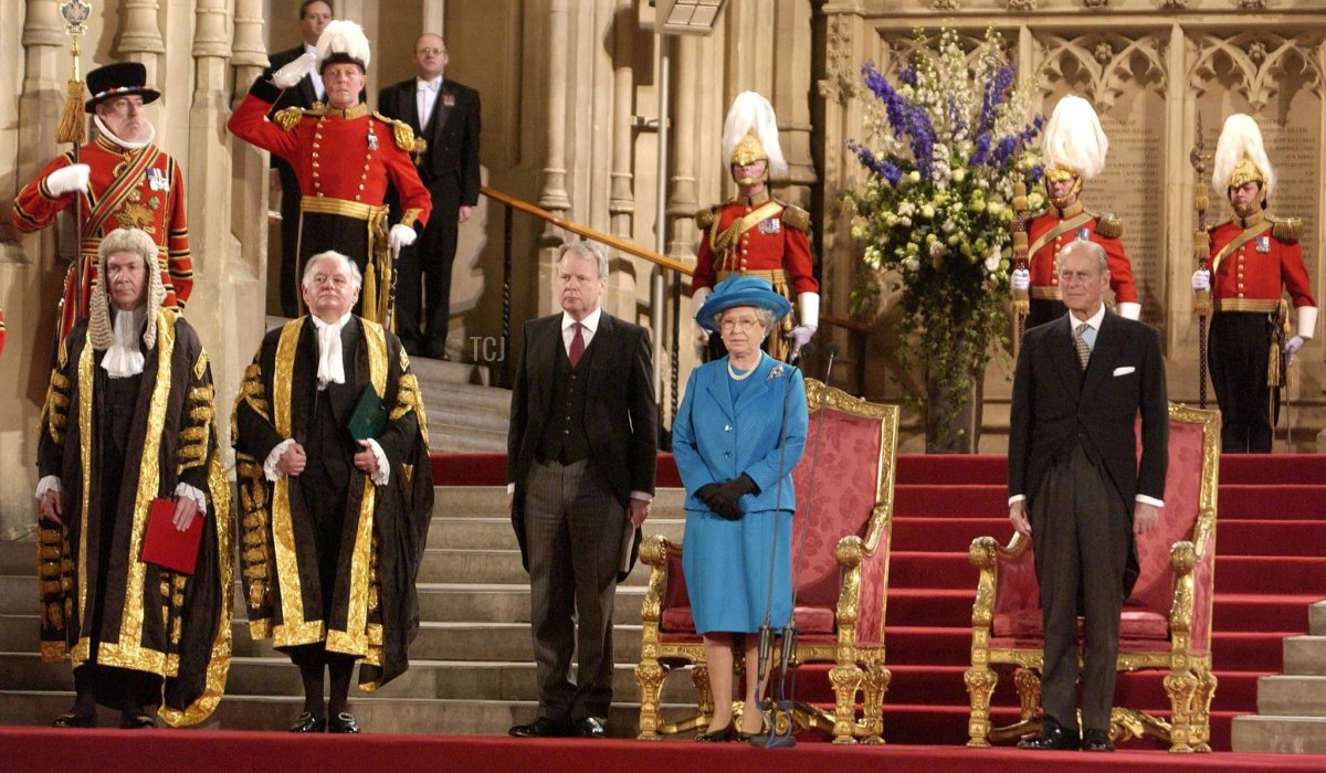 Queen Elizabeth II and the Duke of Edinburgh (R) stand for the National Anthem after the Queen addressed both Houses of Parliament in Westminster Hall, central London, 30 April 2002 to mark the start of her Golden Jubilee celebrations