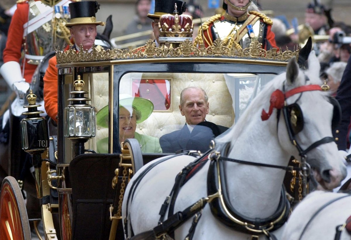 The Queen Elizabeth II and Duke of Edinburgh leave by the horse-drawn "Scottish State Coach" after opening the General Assembly of the Church of Scotland in Edinburgh 25 May 2002, as part of the continuing Golden Jubilee celebrations