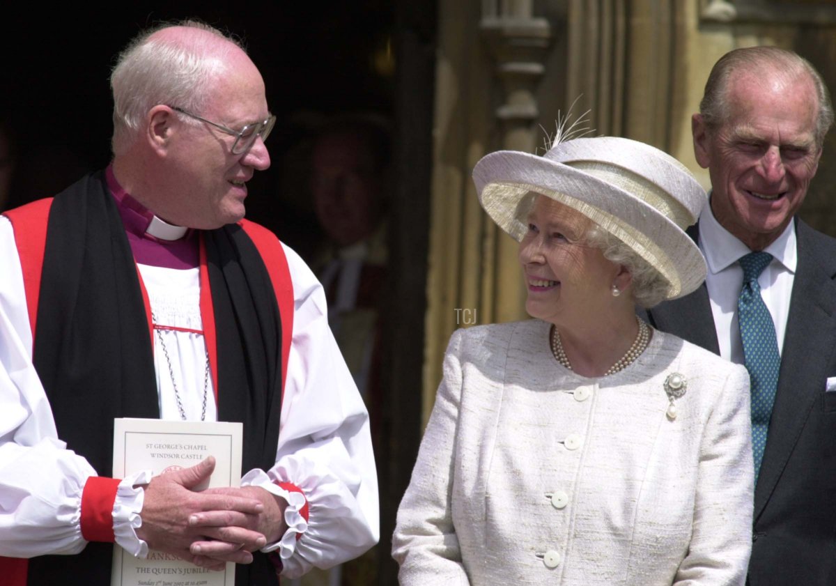 Queen Elizabeth II leaves St. Georges Chapel at Windsor Castle, 02 June, 2002, in conversation with the Archbishop of Canterbury, Dr George Carey, after a service to mark her Golden Jubilee, or fifty years on the throne