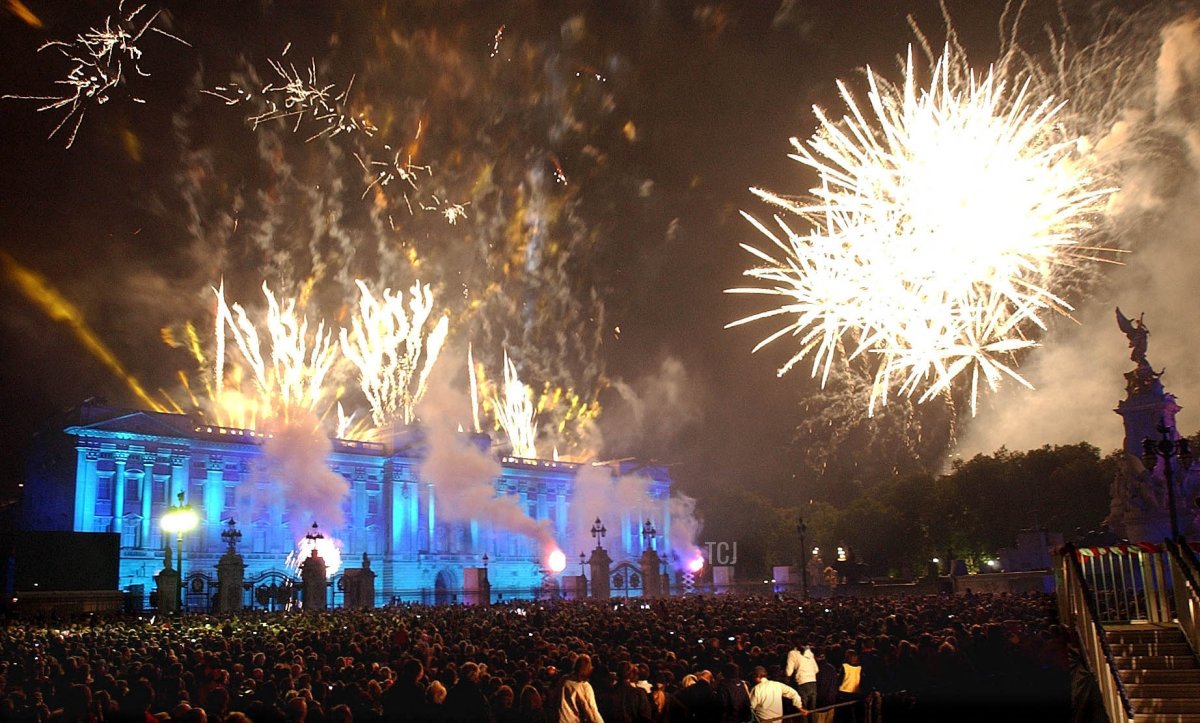 Fireworks burst over Buckingham Palace in London Monday 03 June 2002, after Britain's Queen Elizabeth II lit a beacon to commemorate her Golden Jubilee
