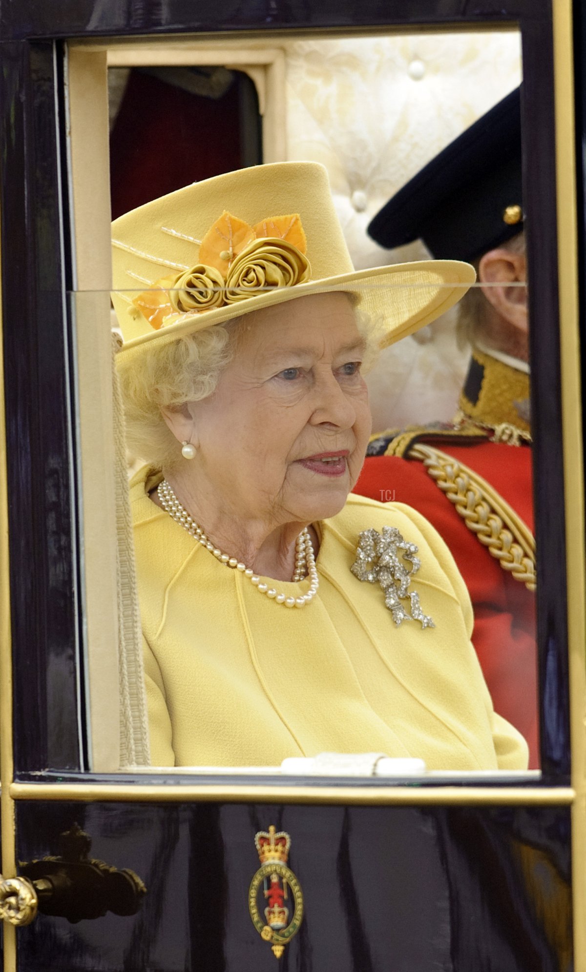 Queen Elizabeth II and Prince Philip, Duke of Edinburgh ride in a carriage procession to Buckingham Palace following the marriage of Their Royal Highnesses Prince William Duke of Cambridge and Catherine Duchess of Cambridge at Westminster Abbey on April 29, 2011 in London, England