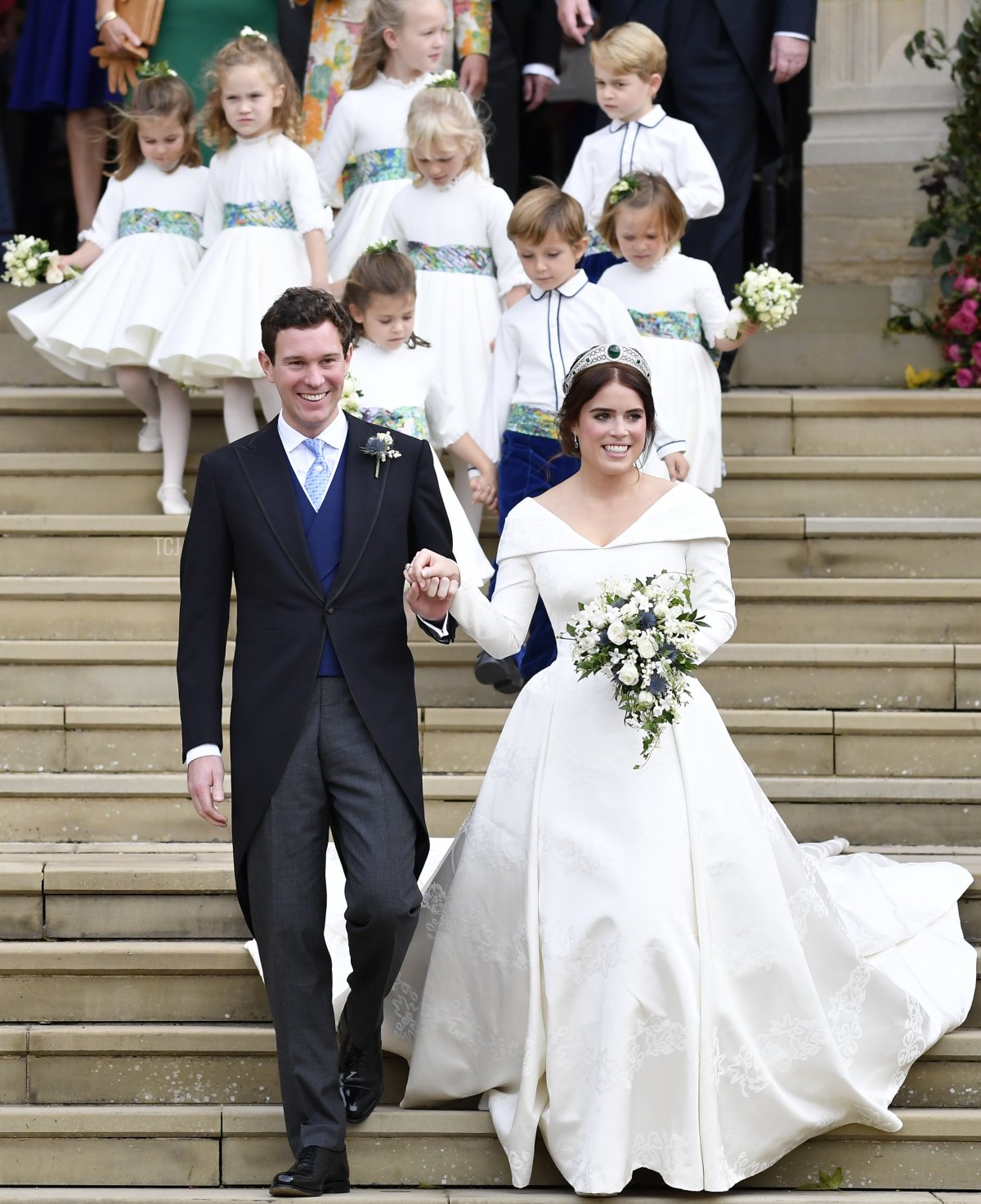 Princess Eugenie of York of York and her husband Jack Brooksbank leave after their wedding at St George's Chapel in Windsor Castle on October 12, 2018 in Windsor, England