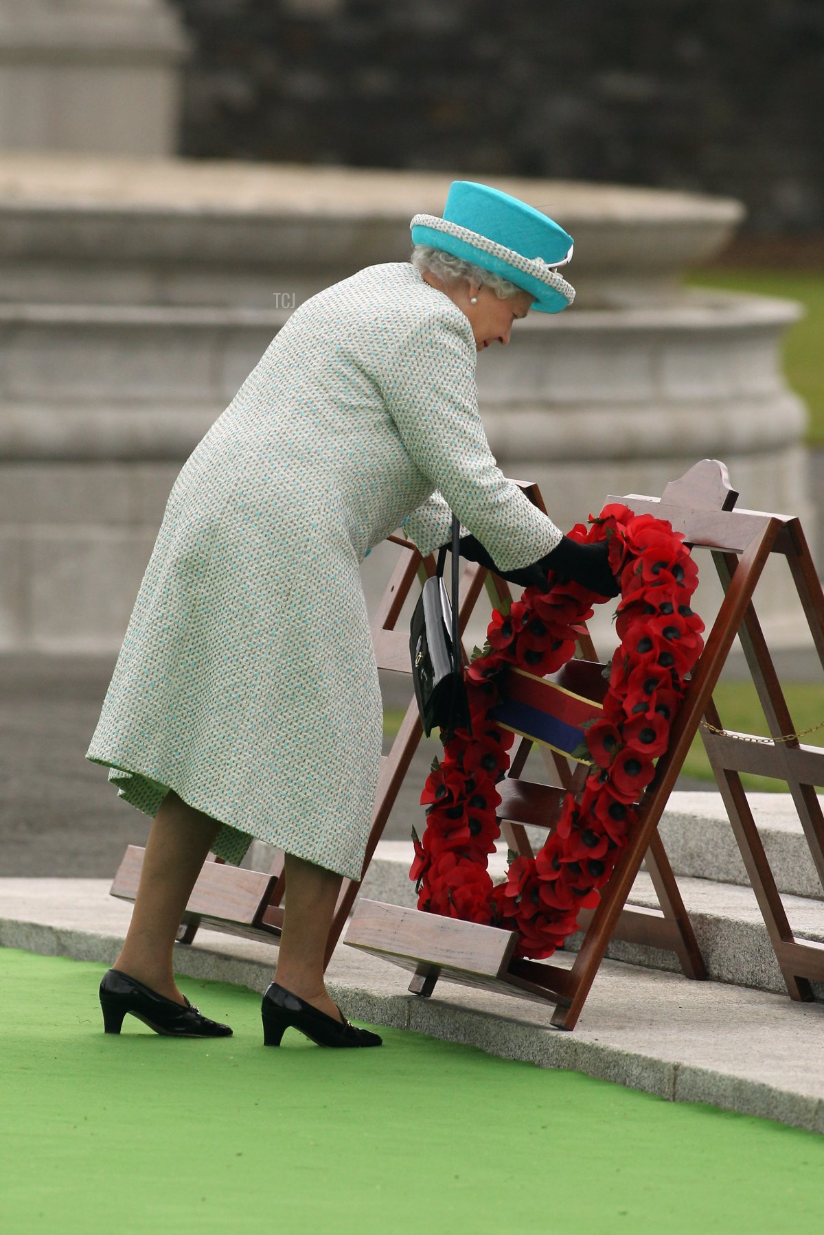 Queen Elizabeth II lays a wreath of poppy flowers at the Irish War Memorial Garden in Islandbridge on May 18, 2011 in Dublin, Ireland