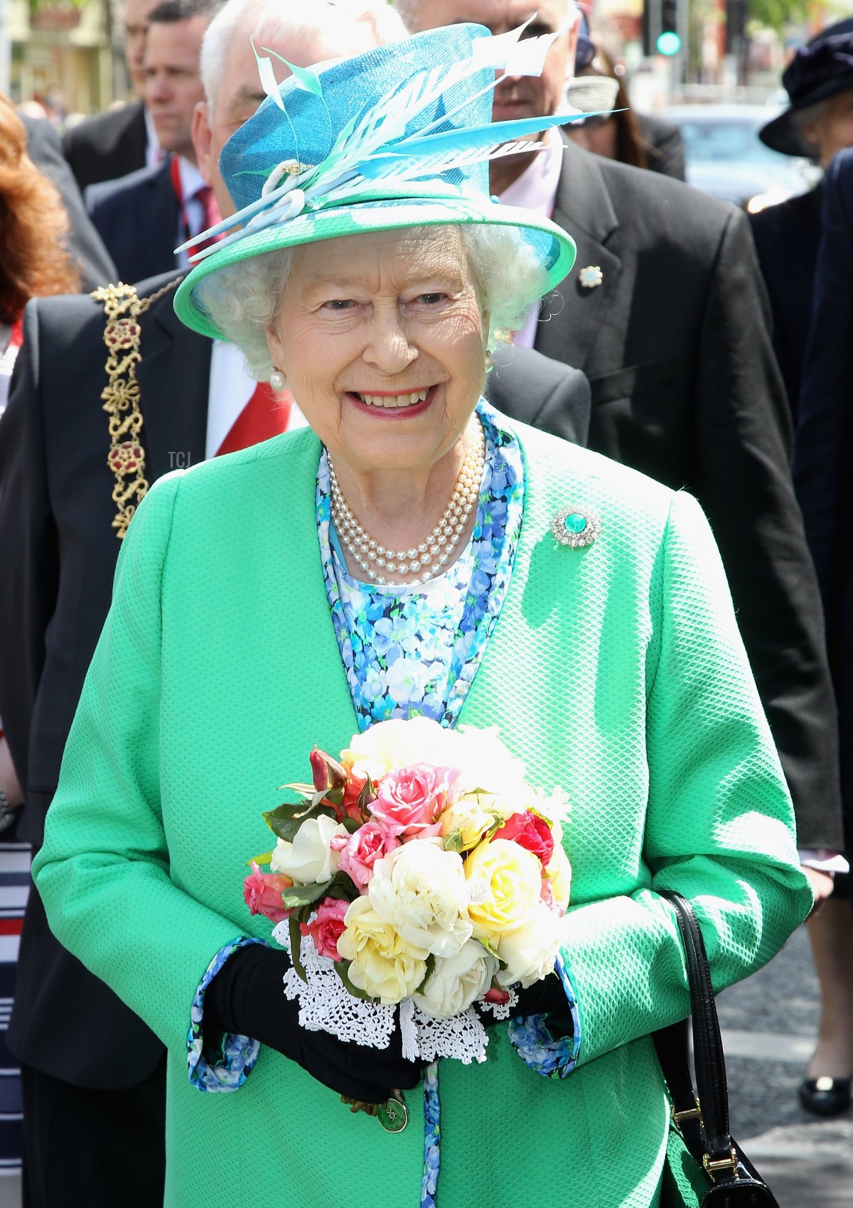 Queen Elizabeth II takes part in a historic first walk-about as she meets members of the public after visiting the English Market on May 20, 2011 in Cork, Ireland