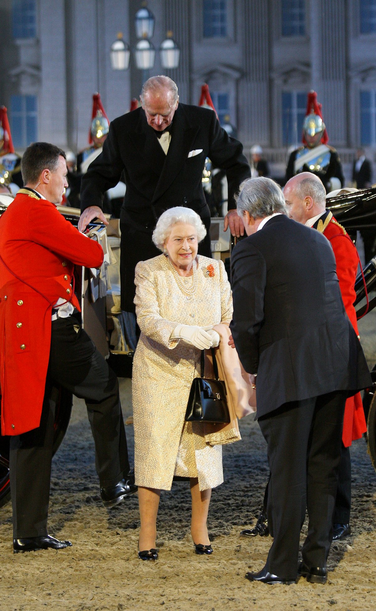 Queen Elizabeth II and Prince Philip, Duke of Edinburgh arrive at the Diamond Jubilee Pageant in the private grounds of Windsor Castle on May 13, 2012 in Windsor, England