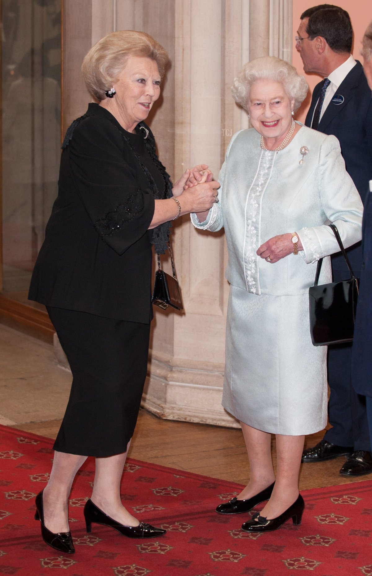 Beatrix, Queen of the Netherlands is greeted by Queen Elizabeth II as he arrives at a lunch for Sovereign Monarch's held in honour of Queen Elizabeth II's Diamond Jubilee, at Windsor Castle, on May 18, 2012 in Windsor, England