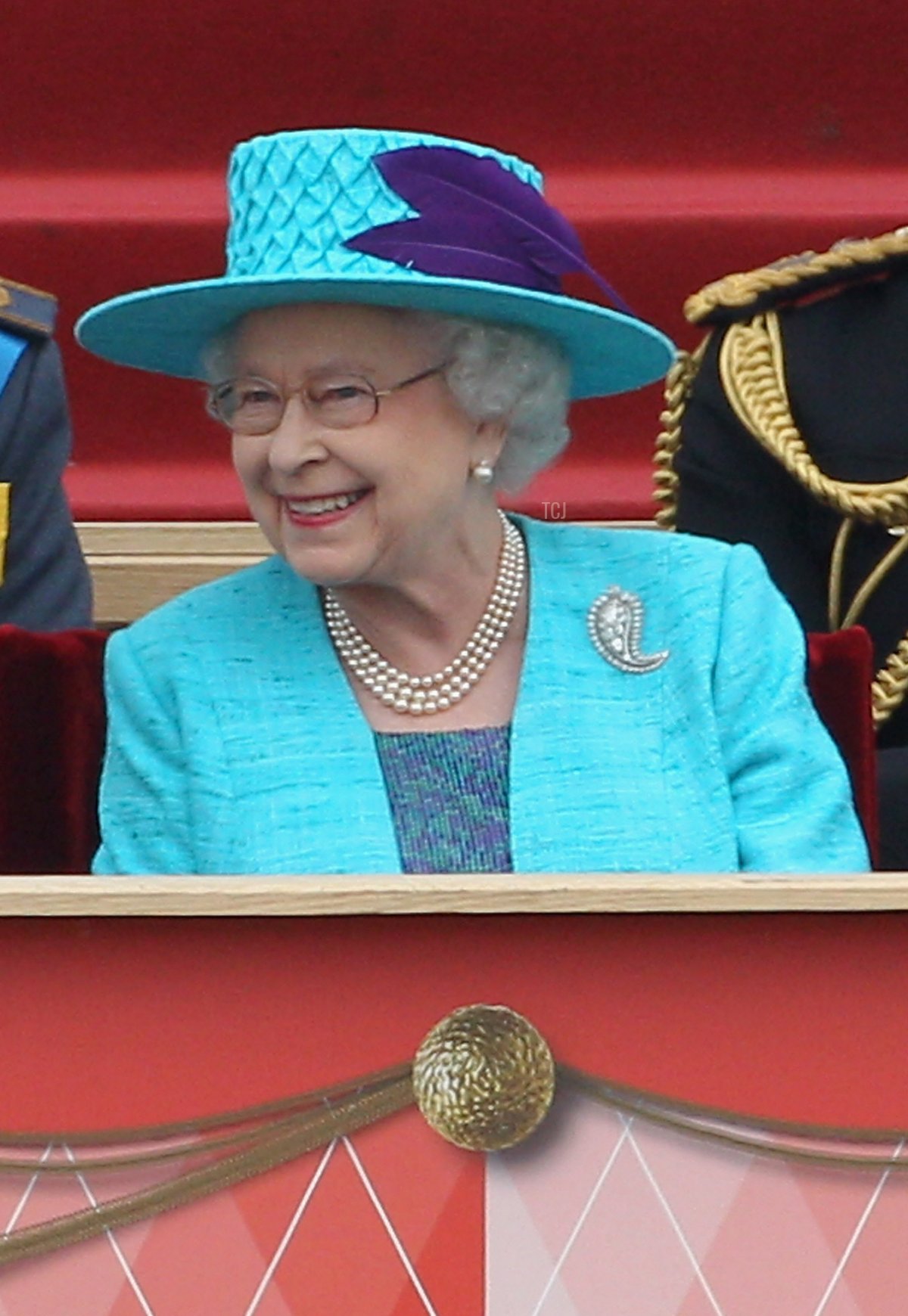 Queen Elizabeth II shares a joke with Chief of the Defence Staff General Sir David Richards (L) as they attend the Armed Forces Parade and Muster on May 19, 2012 in Windsor, England