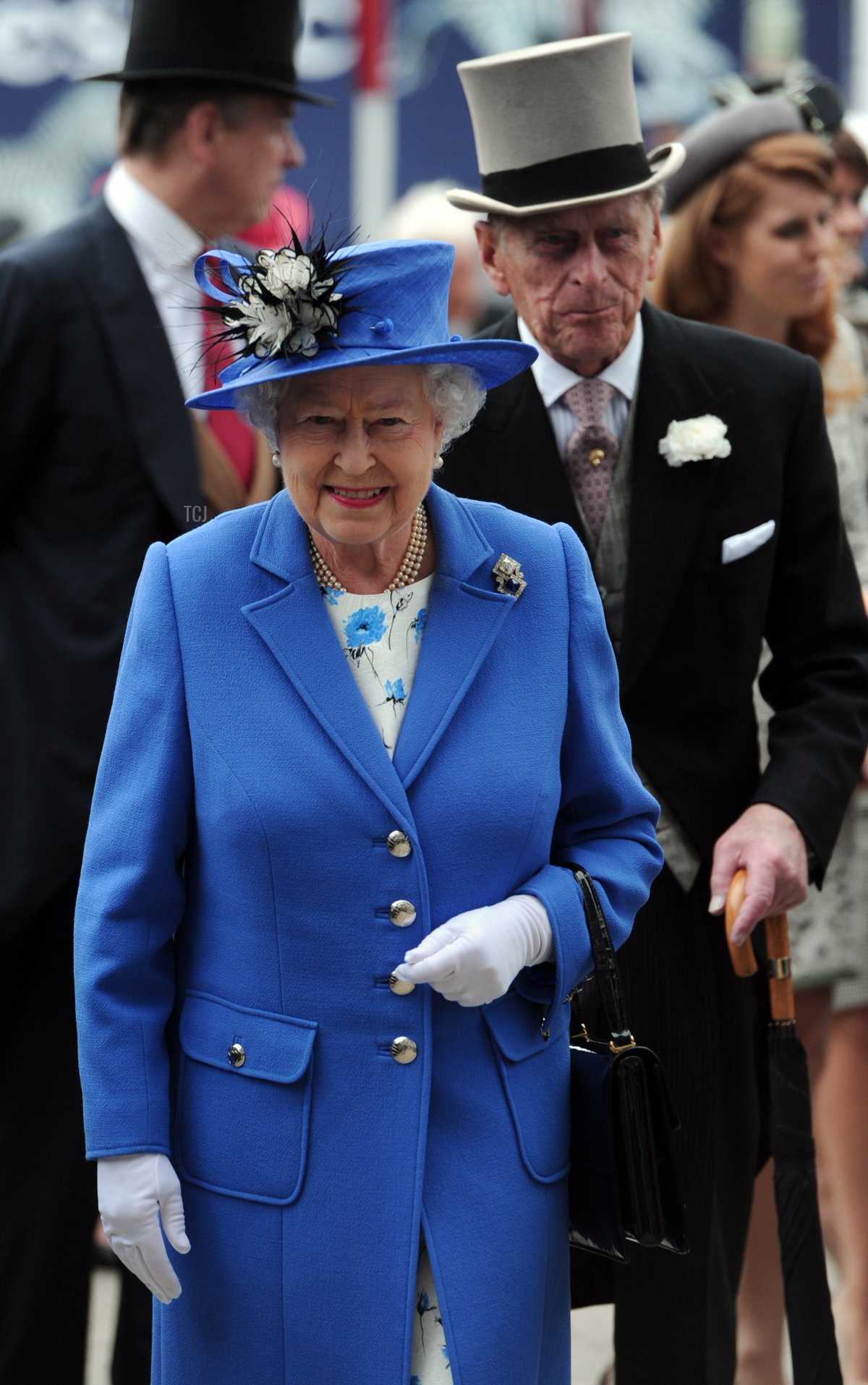 Britain's Queen Elizabeth II (L) and Prince Philip, Duke of Edinburgh (R) arrive on Derby Day, the second day of the Epsom Derby horse racing festival, at Epsom in Surrey, southern England, on June 2, 2012 the first official day of Britain's Queen Elizabeth II's Diamond Jubilee celebrations